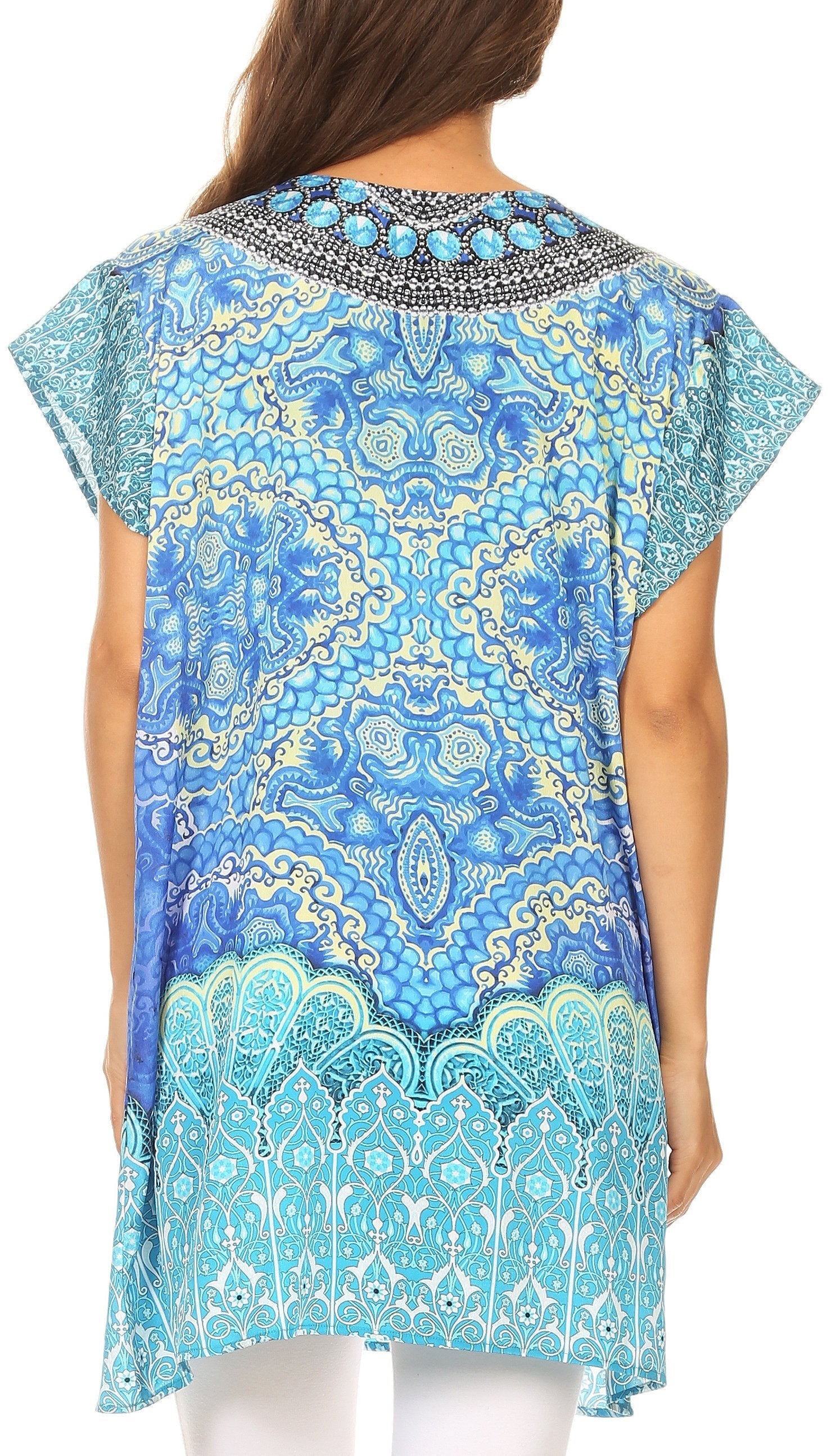 Woman wearing a blue and green patterned top with a white background