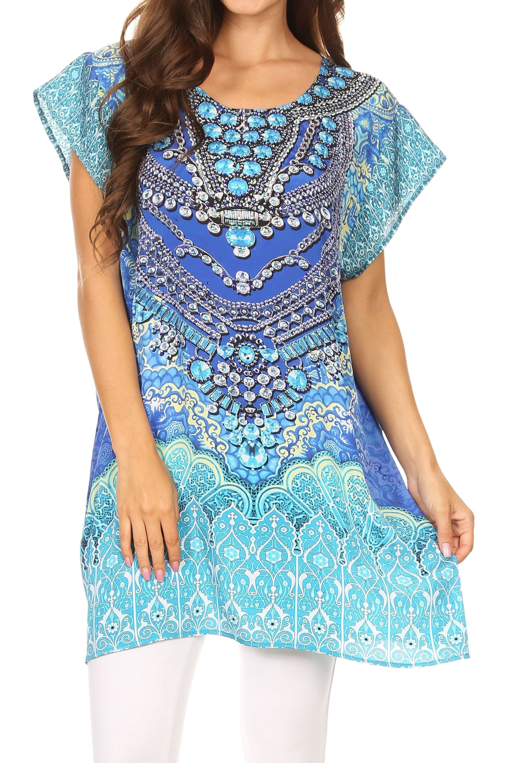Blue and turquoise embroidered dress with intricate patterns on a white background