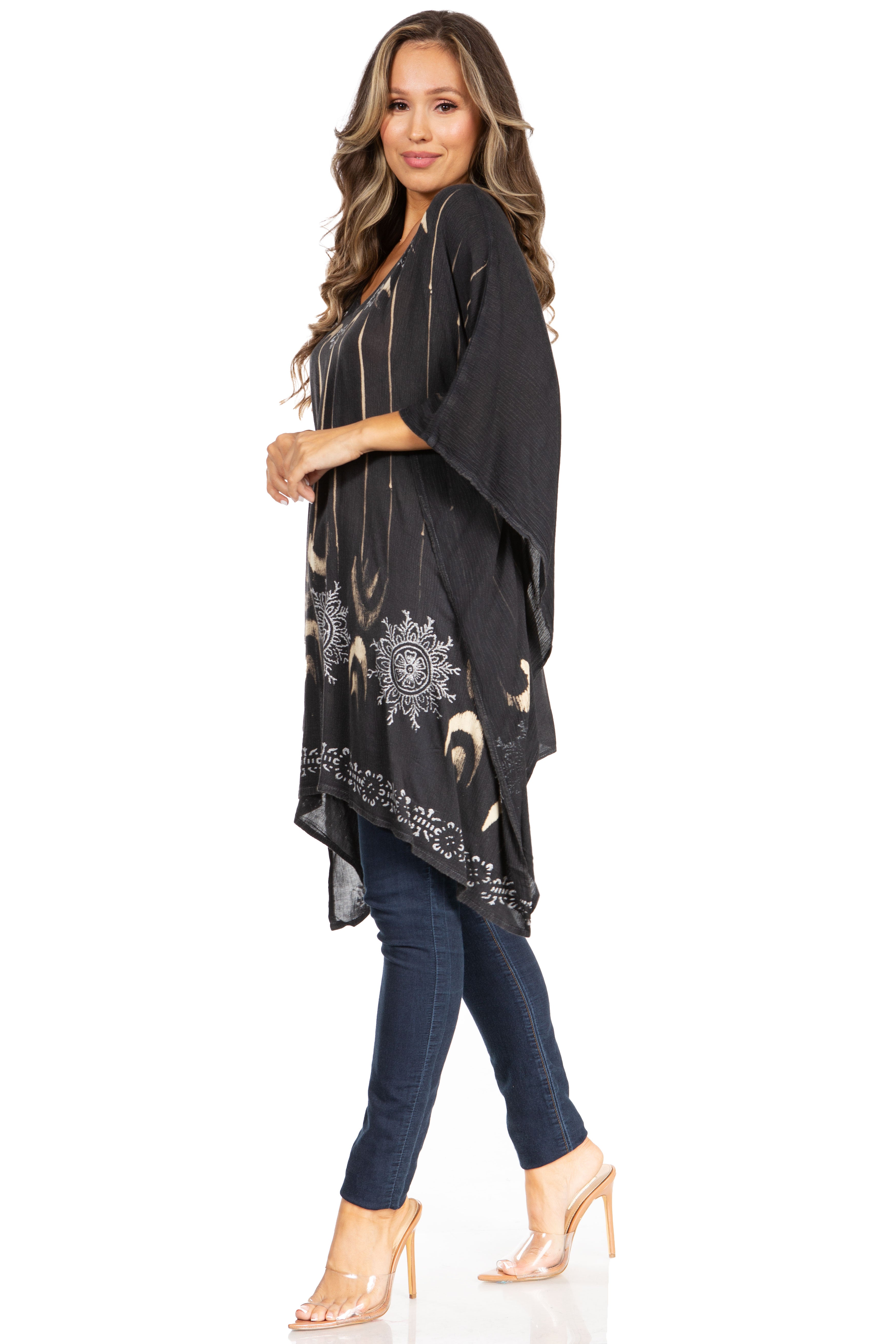 Woman wearing a black patterned kimono-style garment on a white background