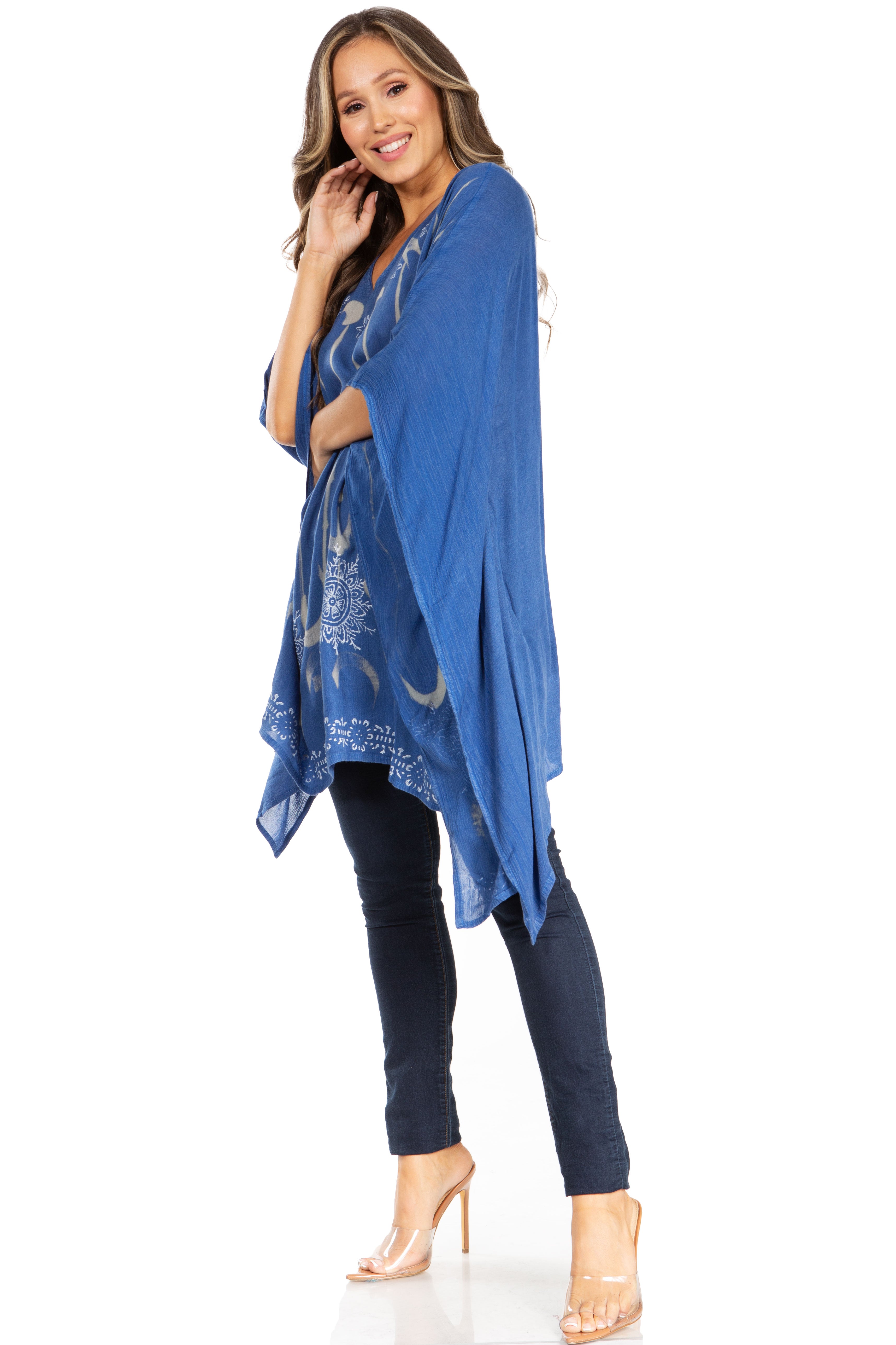 Woman wearing a blue patterned kimono-style garment on a white background