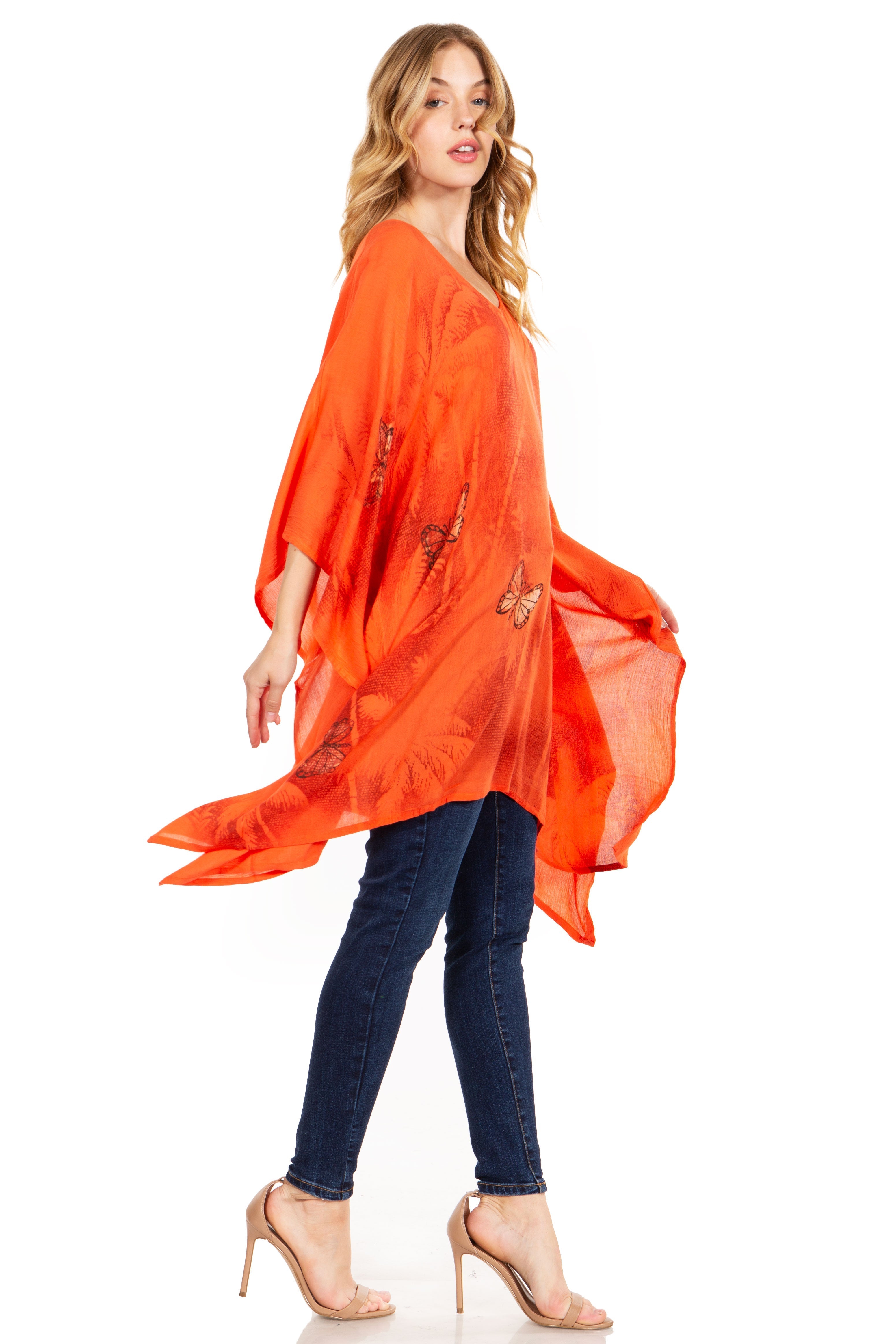Woman wearing an orange scarf and blue jeans on a white background