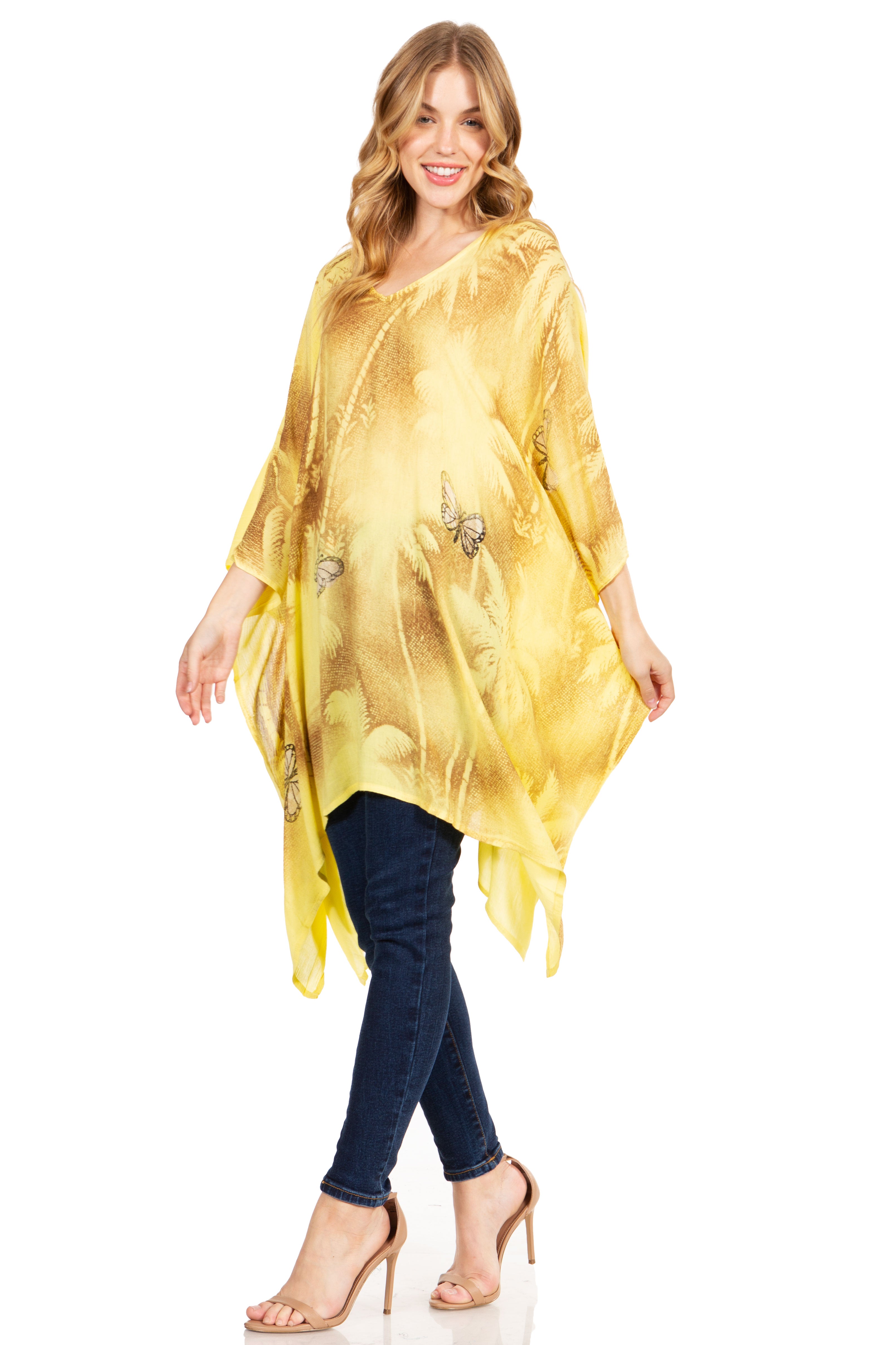 Woman wearing a yellow sheer top with a white background
