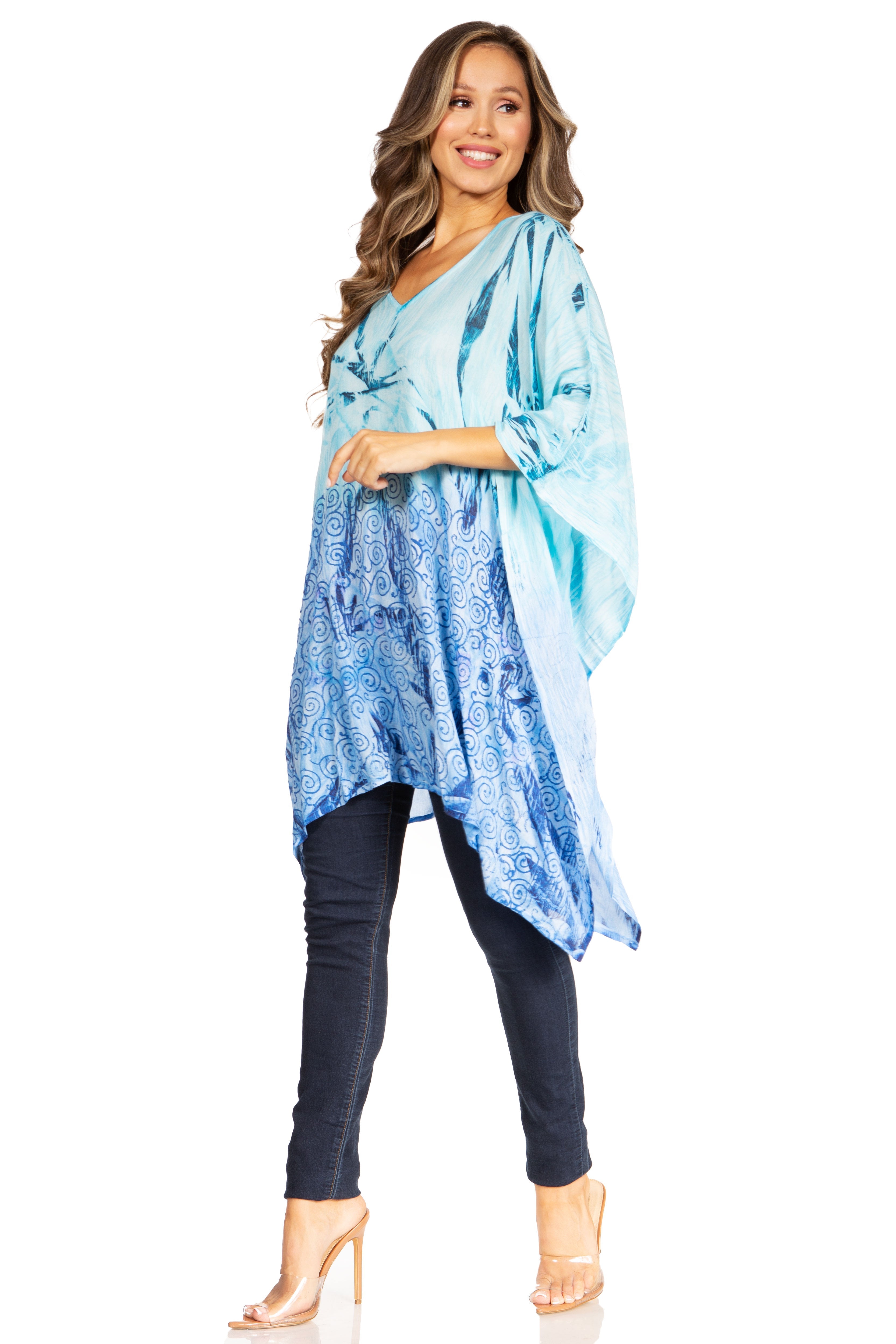 Woman wearing a blue and white patterned kimono-style garment on a white background