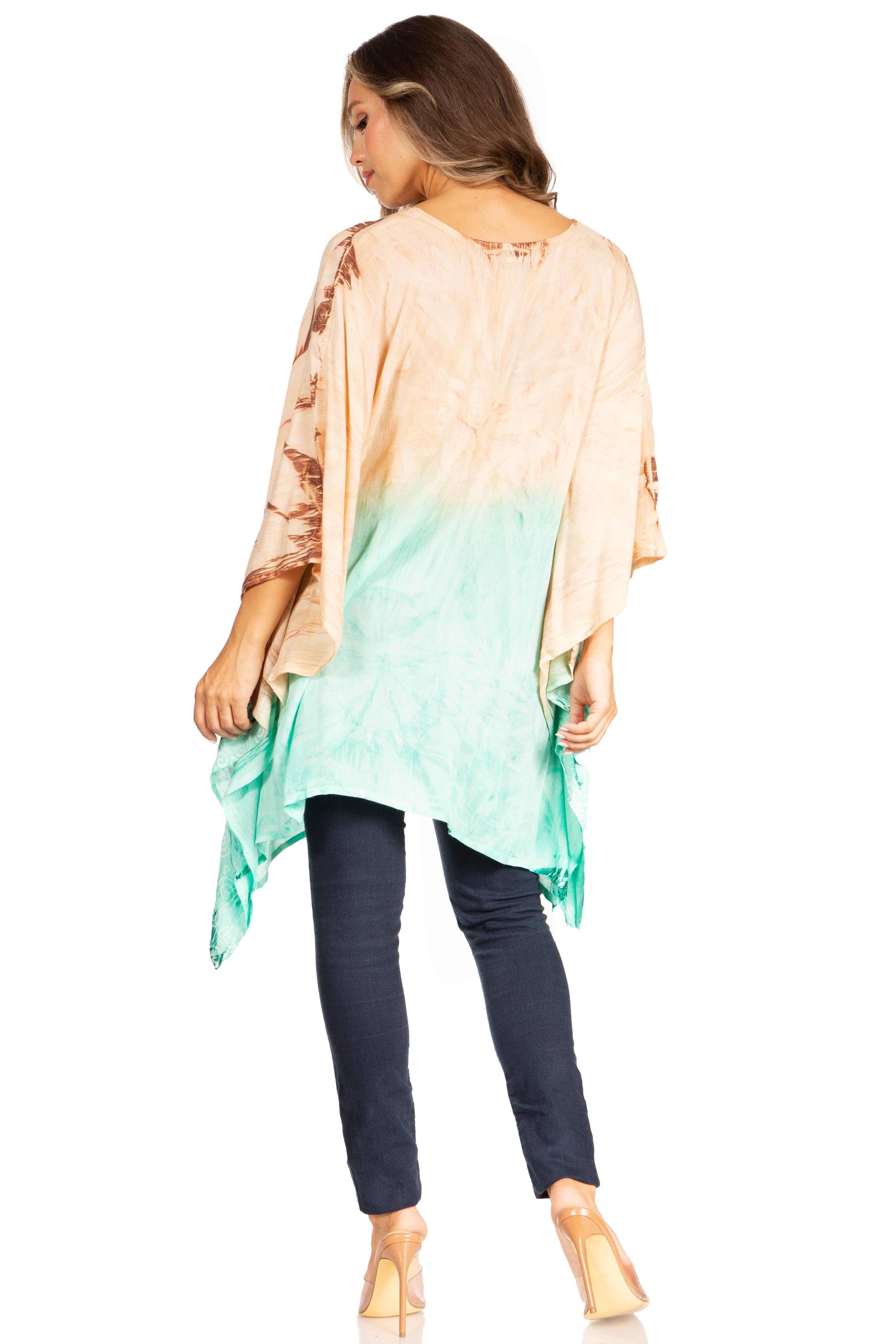 Woman wearing a colorful, gradient top with a white background