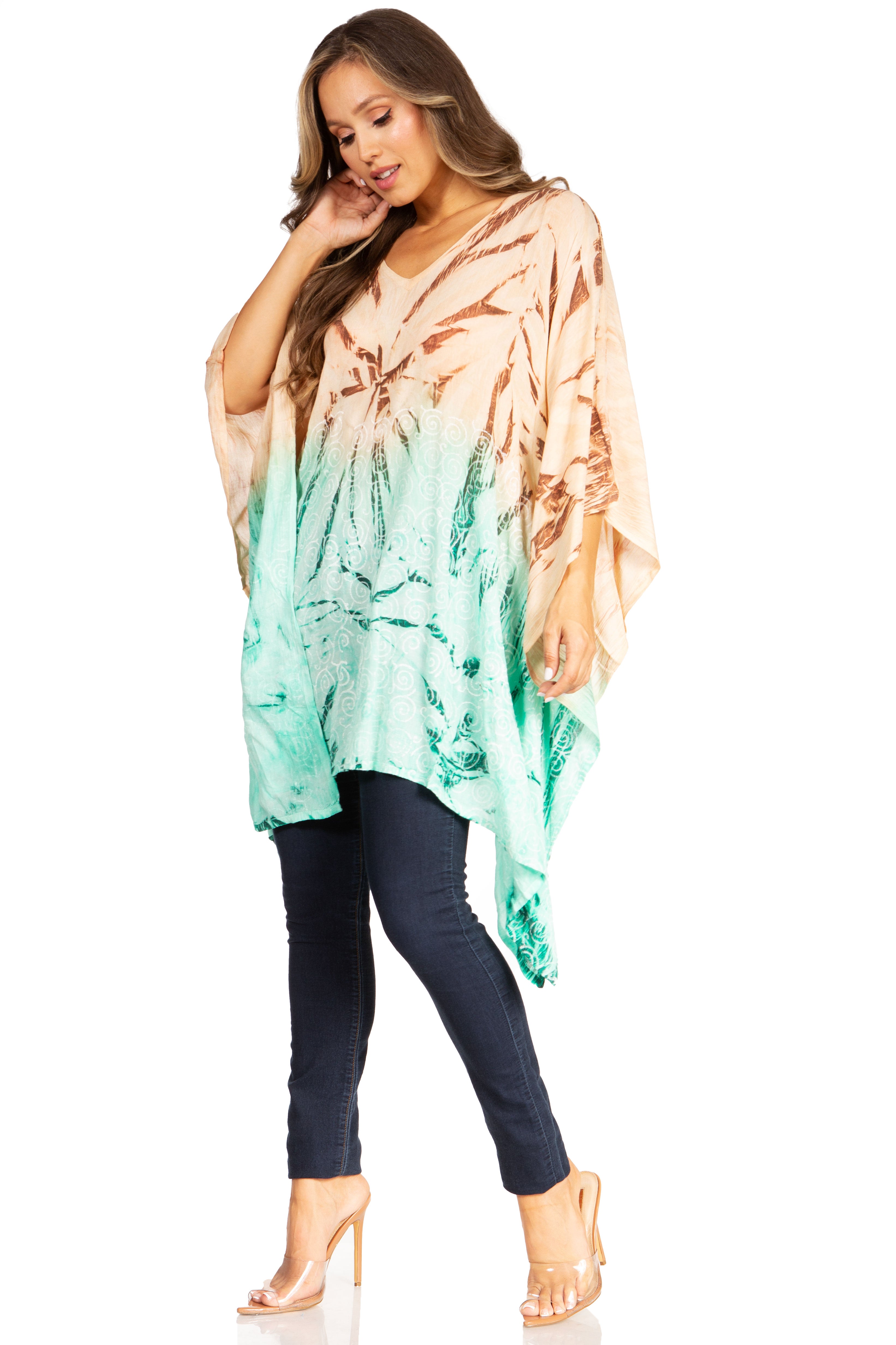 Woman wearing a tie-dye kimono over a black outfit on a white background