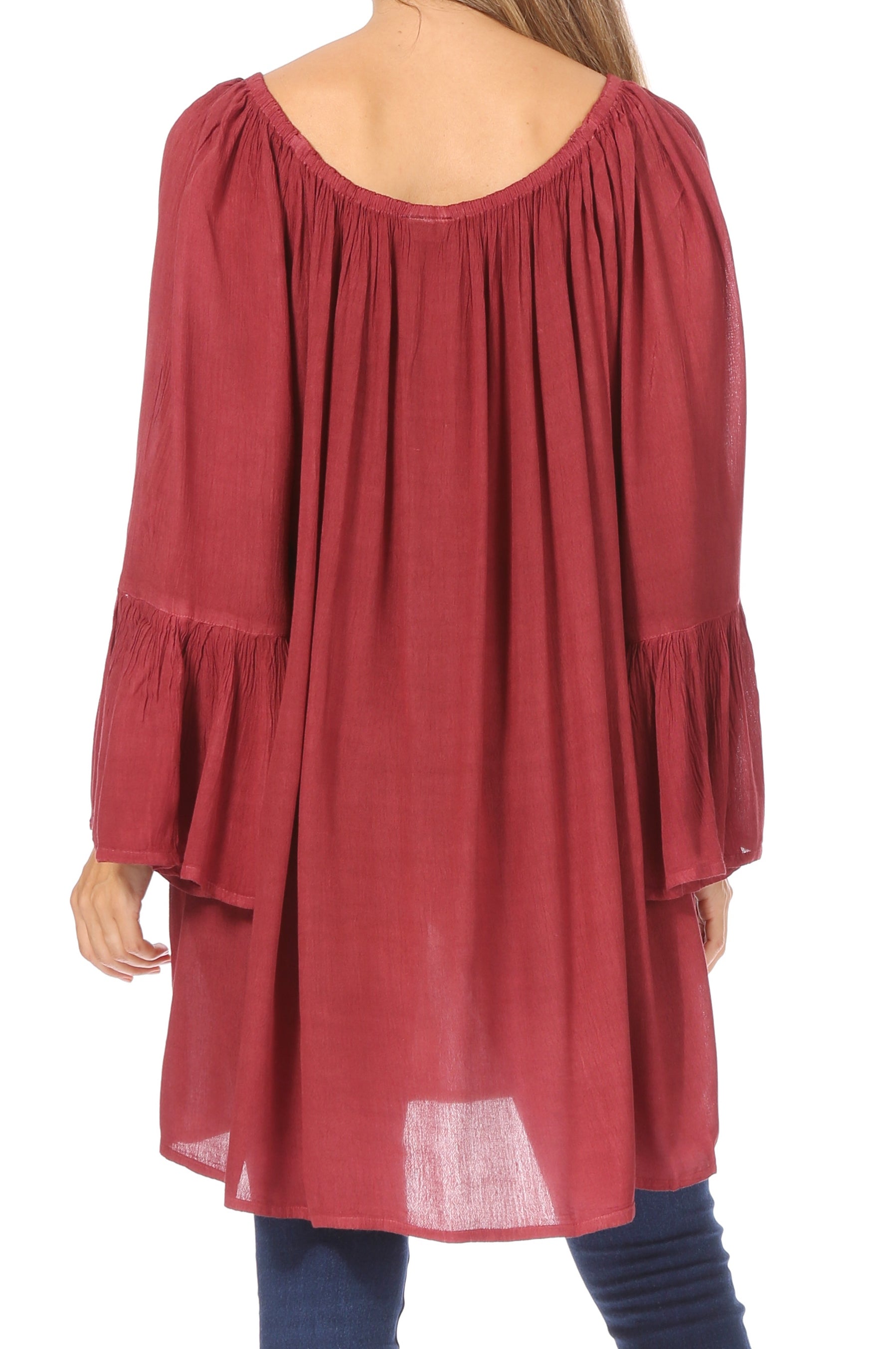 Red long-sleeve dress worn by a person on a white background