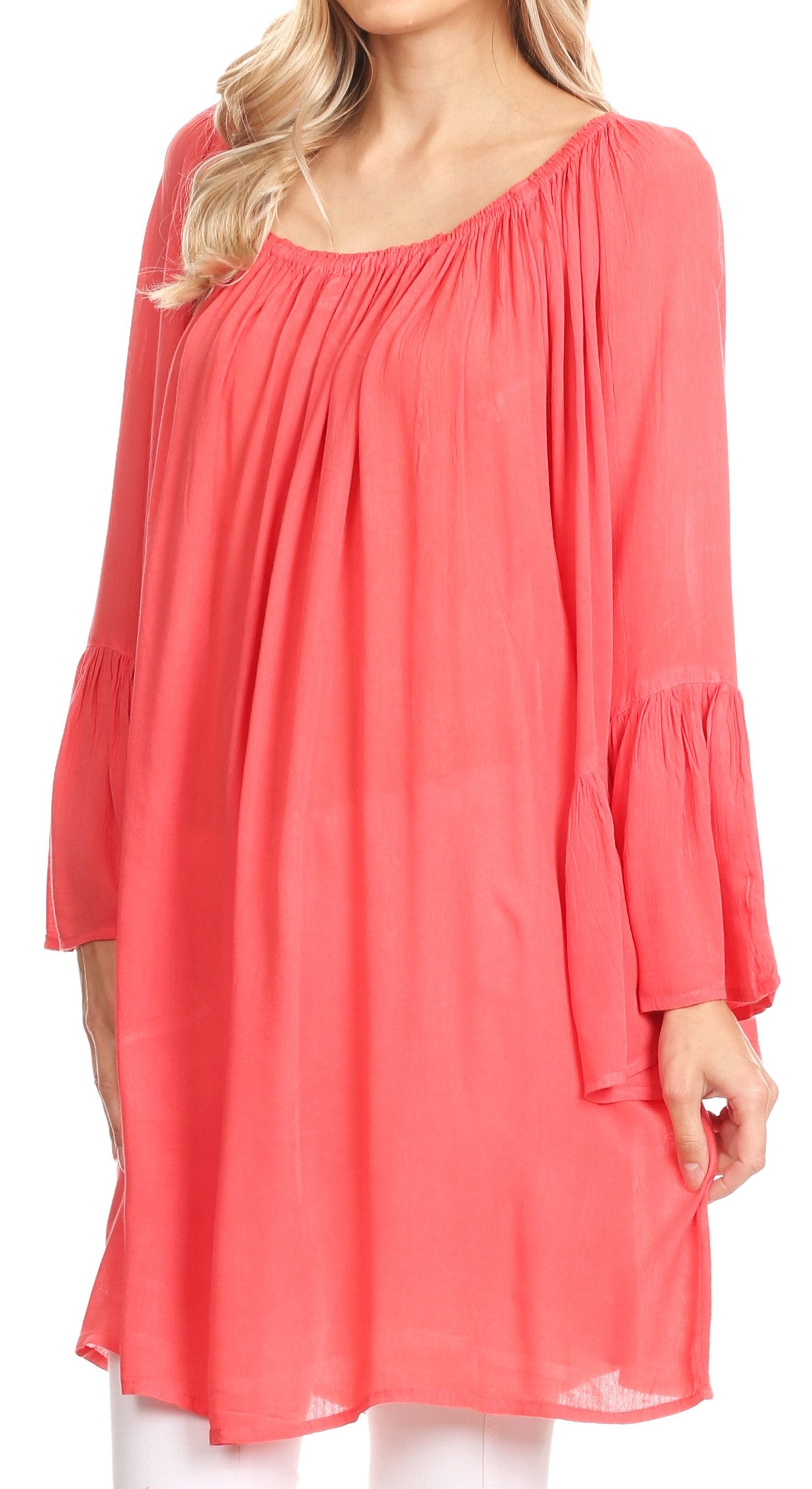 Coral dress worn by a model on a white background