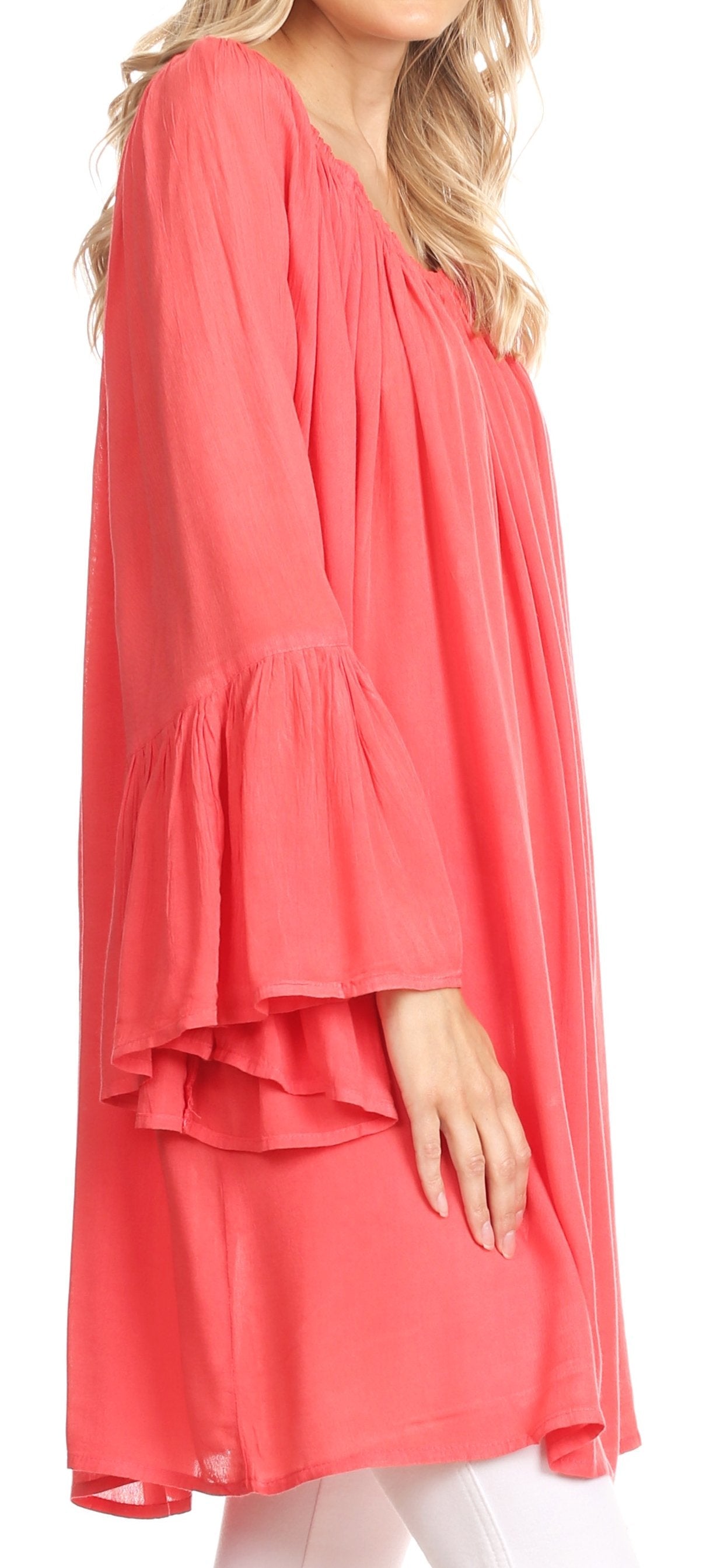 Coral-colored dress with a layered design on a white background