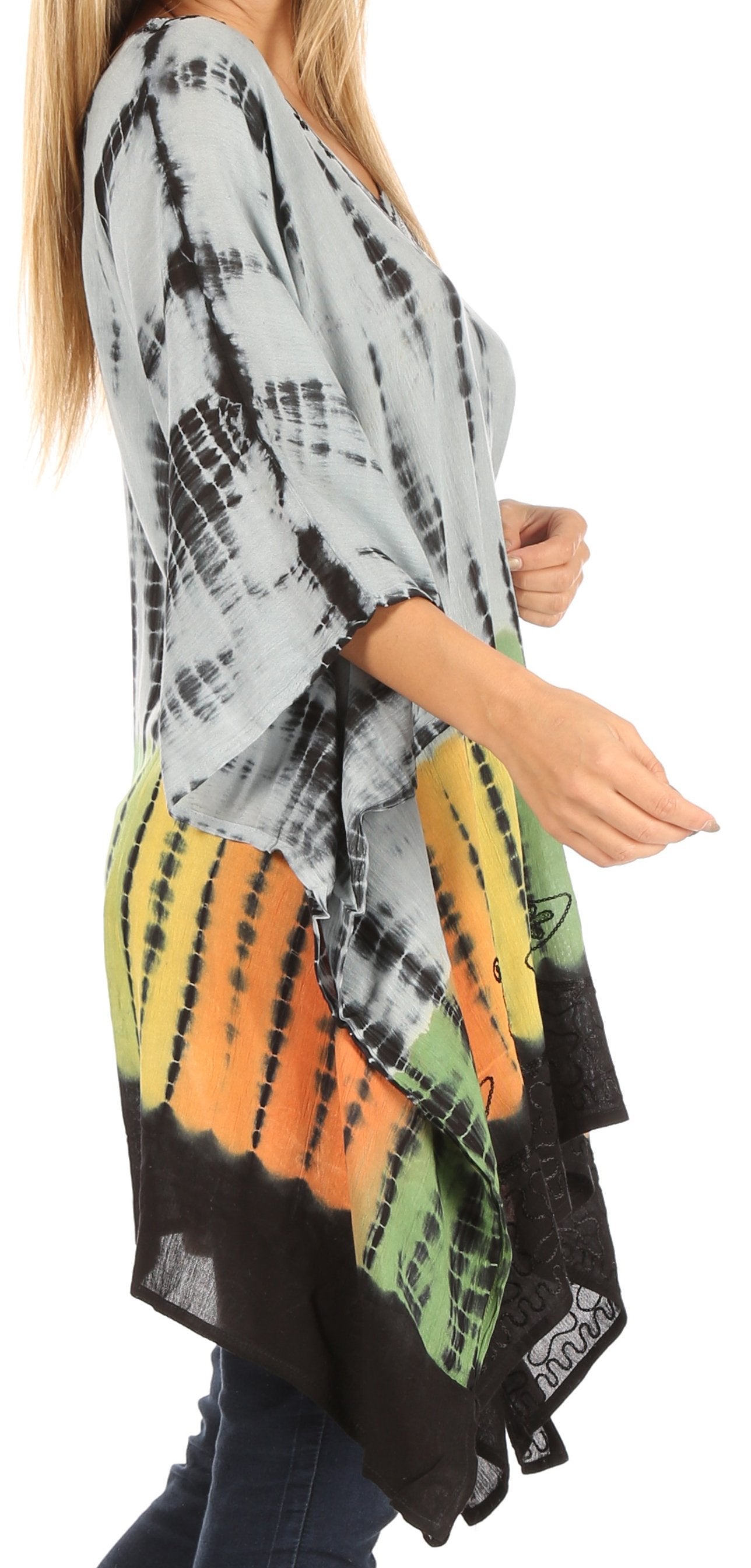 Person wearing a tie-dye kimono with black, orange, and green patterns on a white background