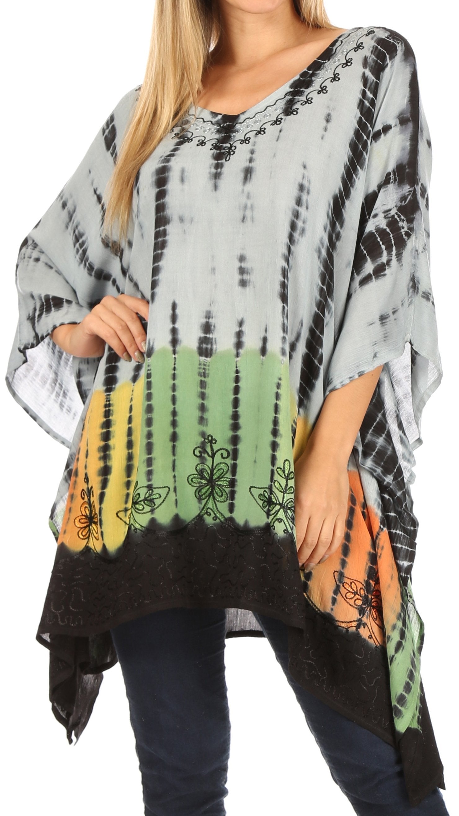 Tie-dye poncho with colorful pattern worn by a person on a white background