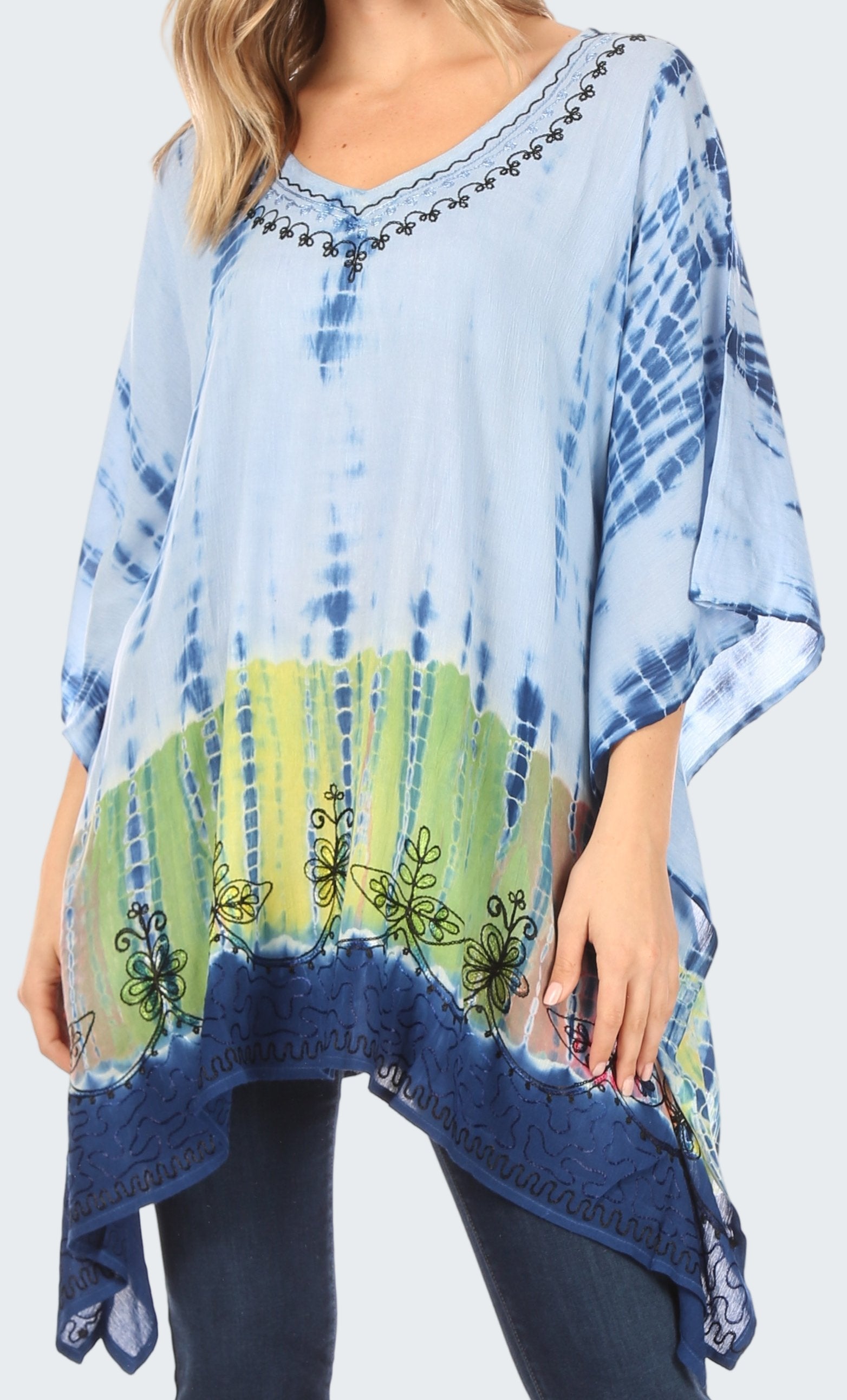 Blue and green tie-dye poncho with embroidery on a white background