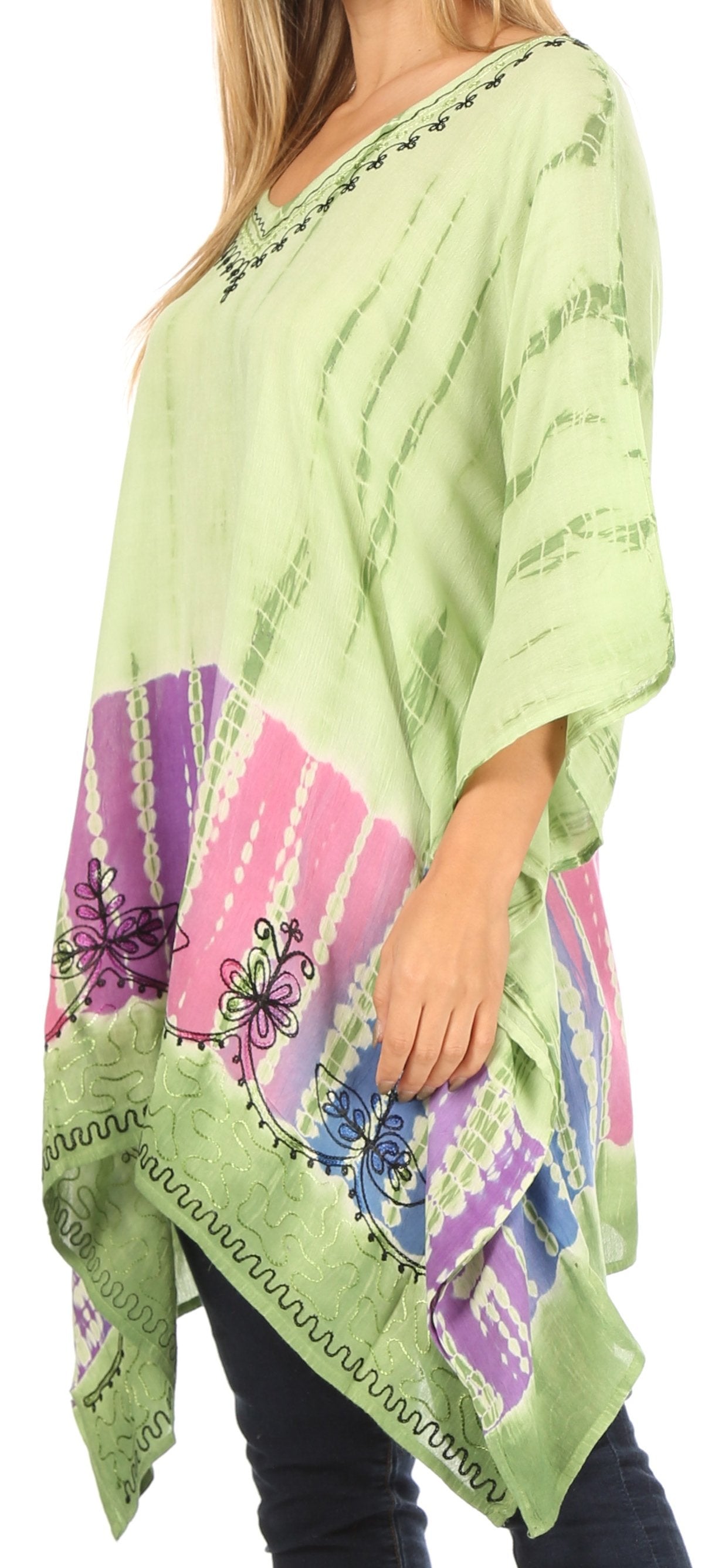 Light green poncho with colorful butterfly design worn by a person