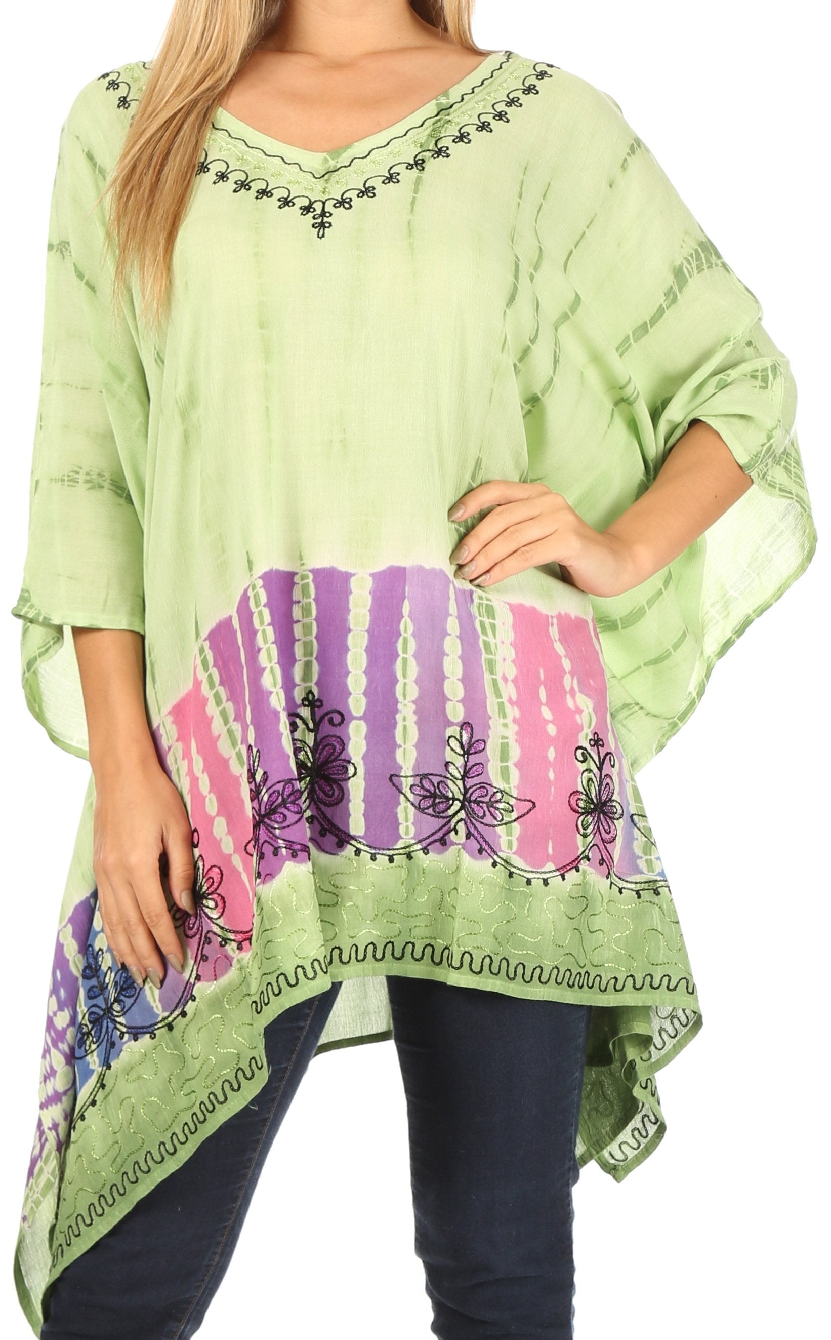 Light green poncho with colorful pattern and embroidery on a white background