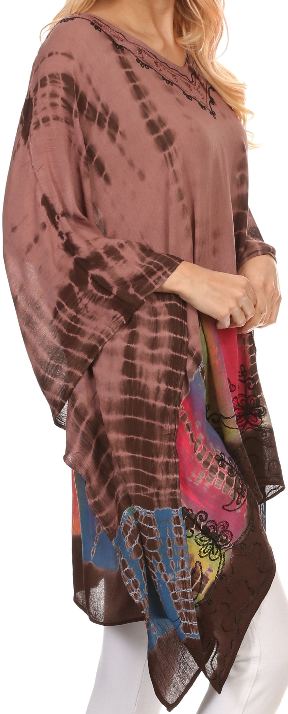 Woman wearing a brown tie-dye kimono-style top with colorful patterns.