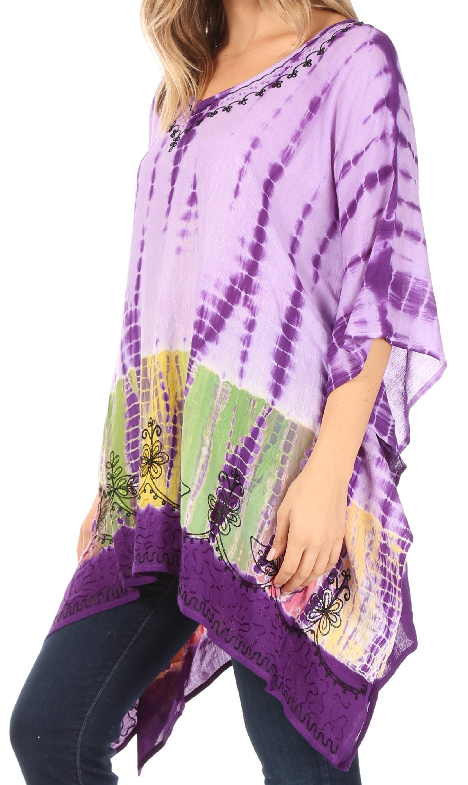 Purple tie-dye poncho with colorful butterfly designs worn by a person on a white background