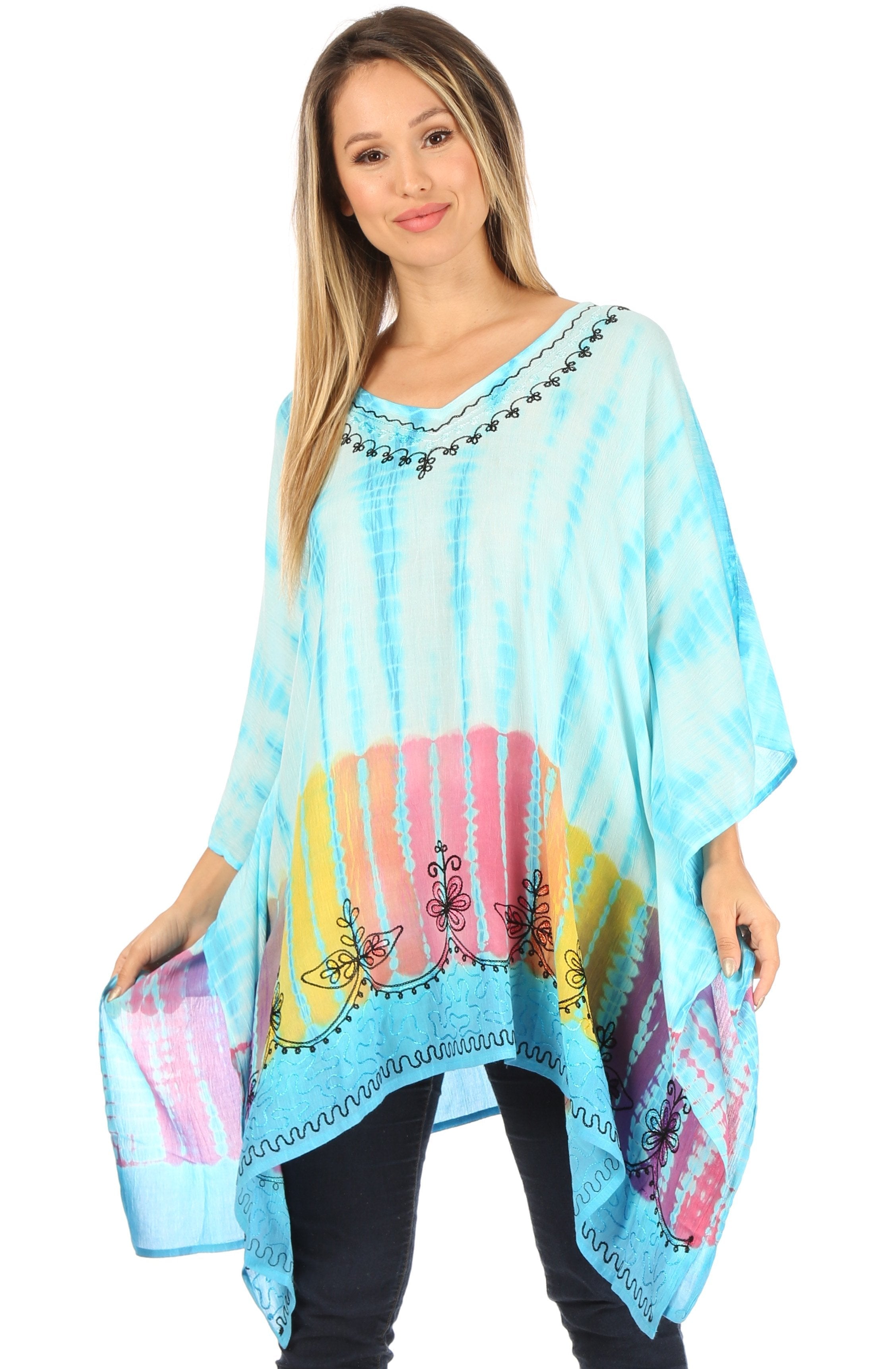 Woman wearing a colorful poncho with an elephant design on a white background
