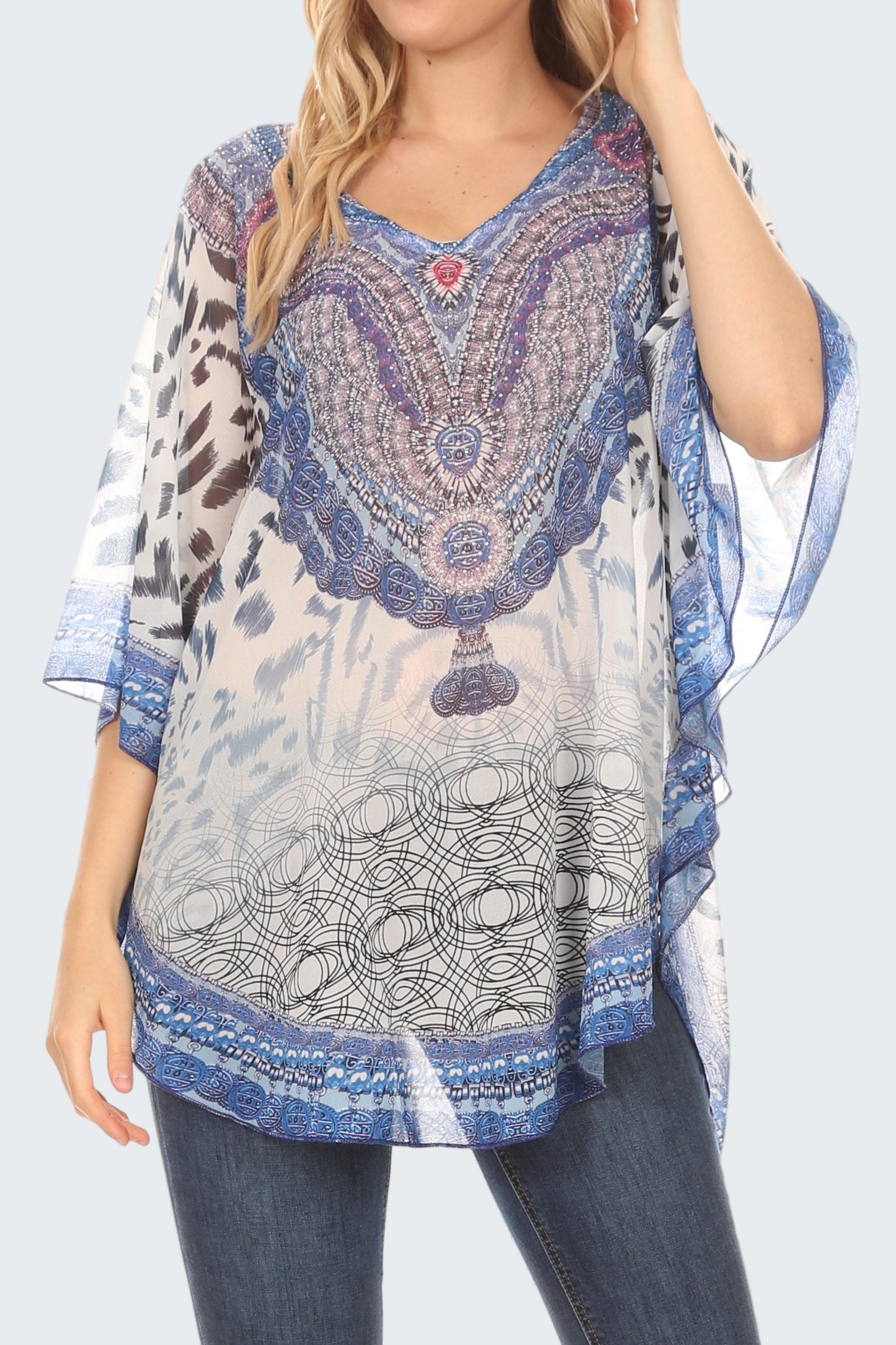Woman wearing a patterned blouse with a blue and white design