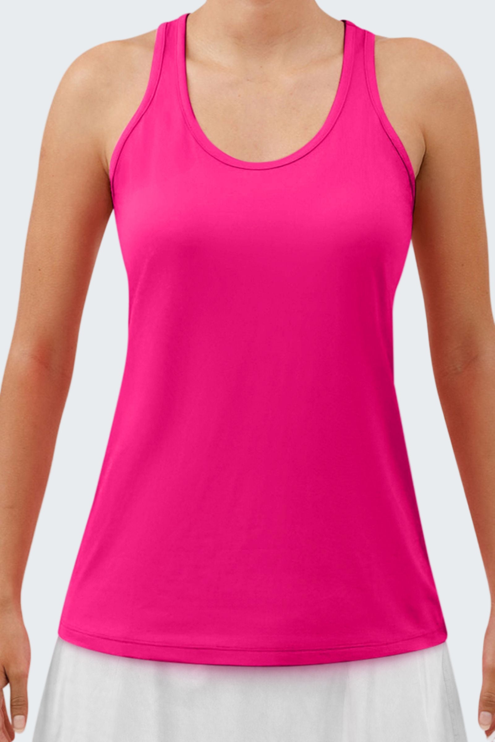 Pink tank top worn by a person on a white background