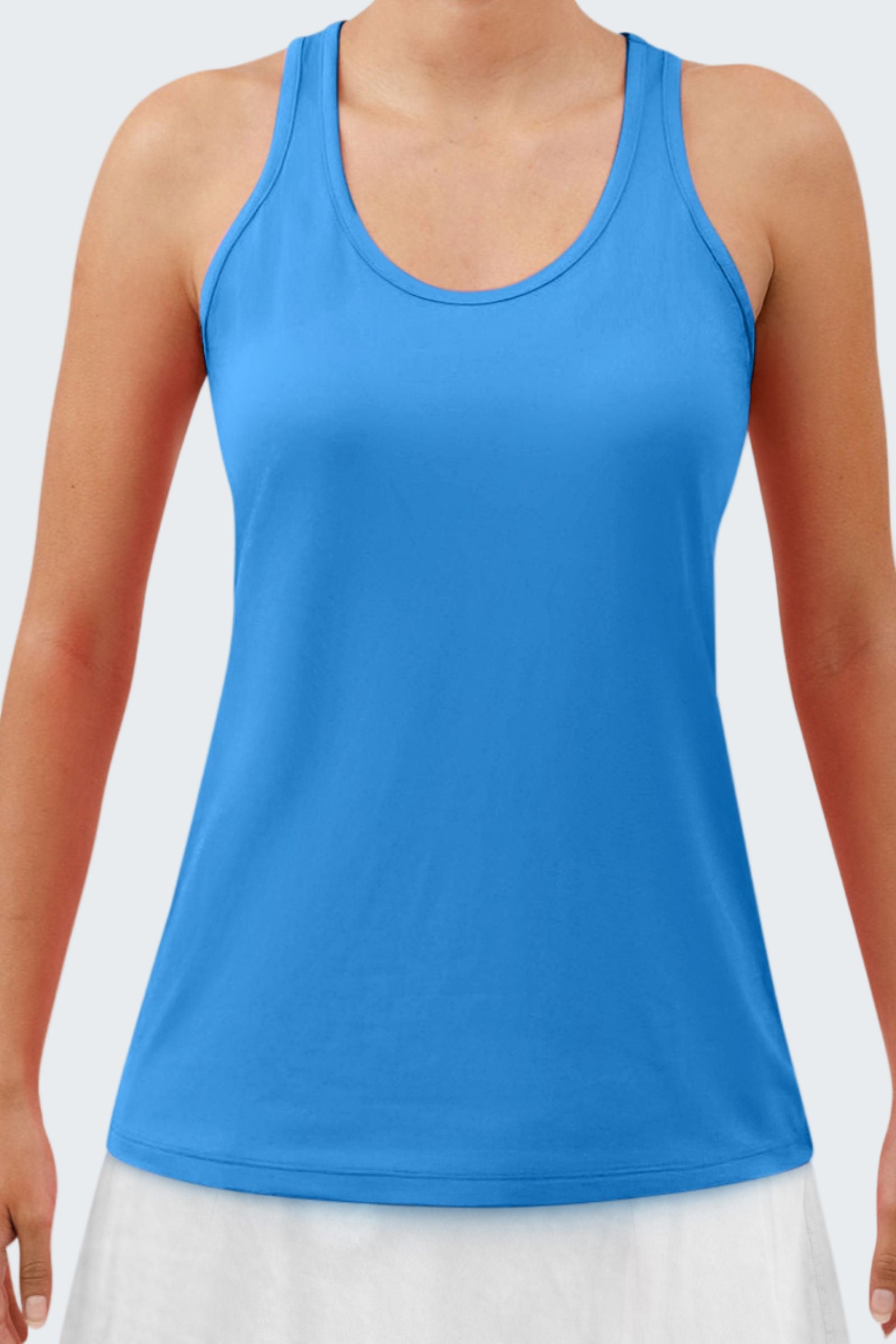 Blue tank top worn by a person on a white background