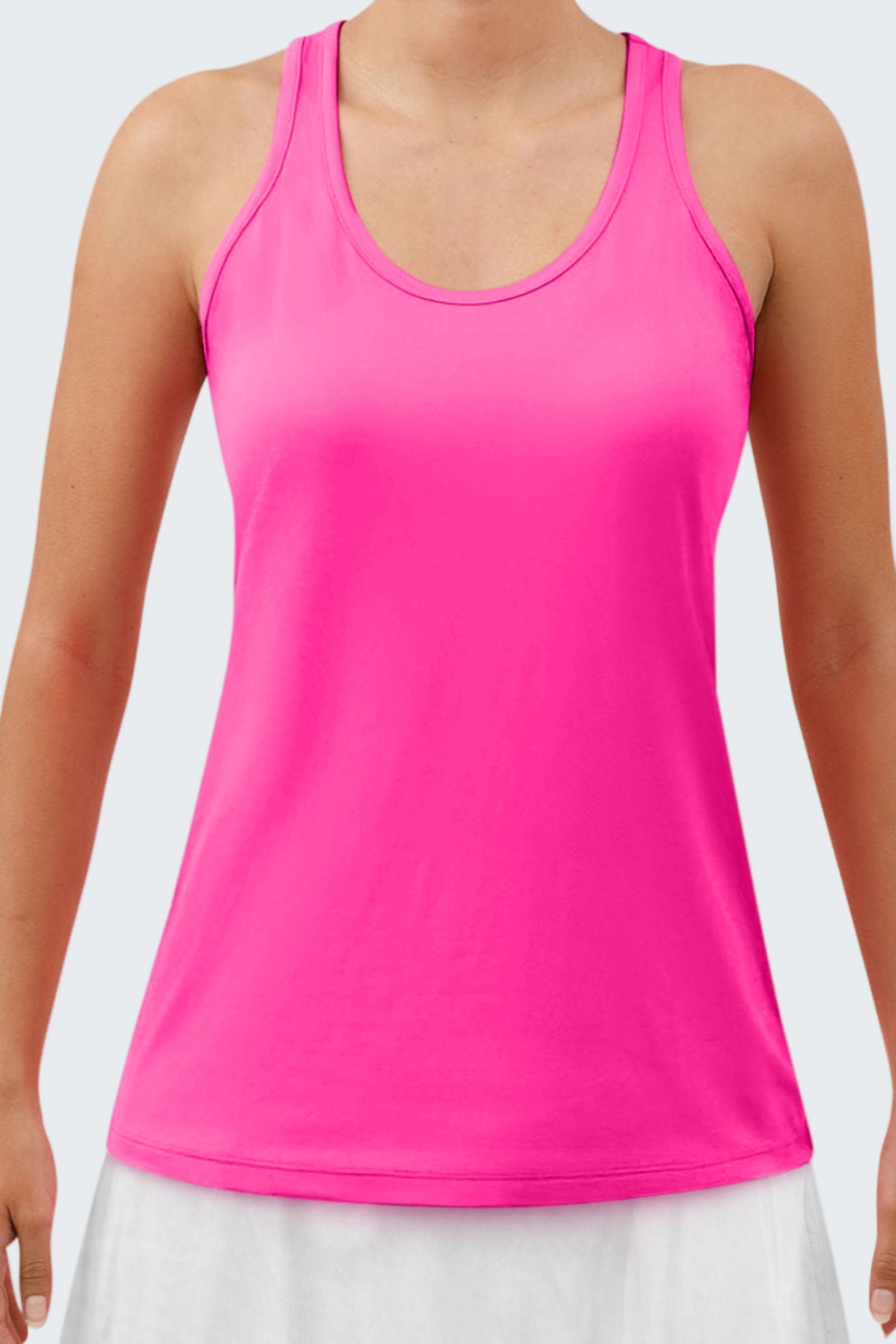 Pink tank top worn by a person on a white background