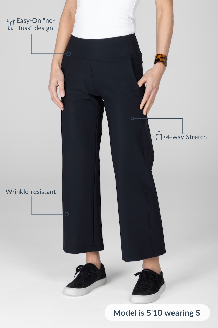 Person wearing black pants with text highlighting features on a white background