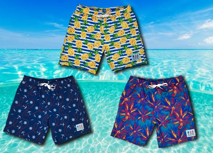Three pairs of patterned shorts displayed against a beach background