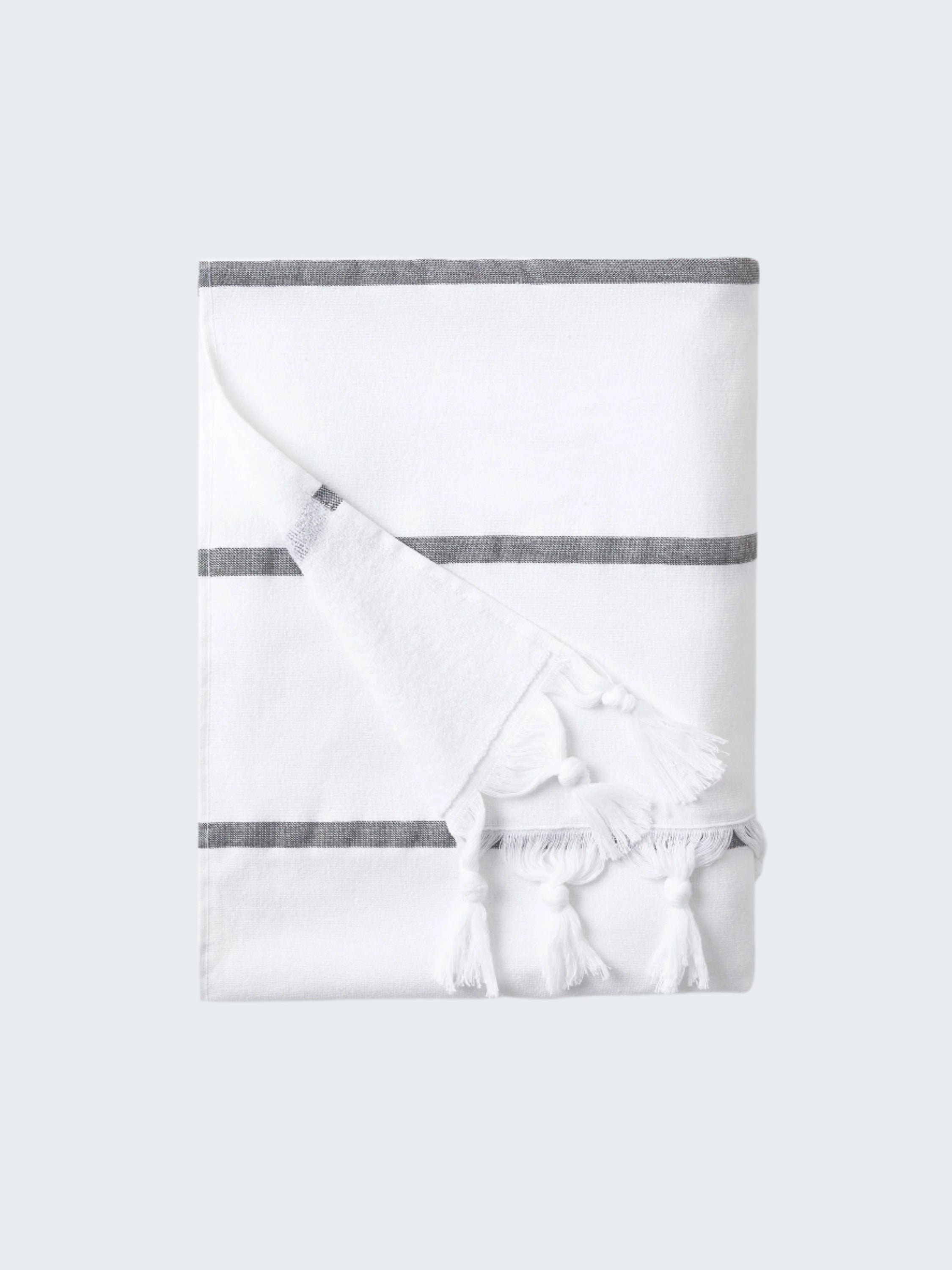 White baby blanket with gray stripes on a white background