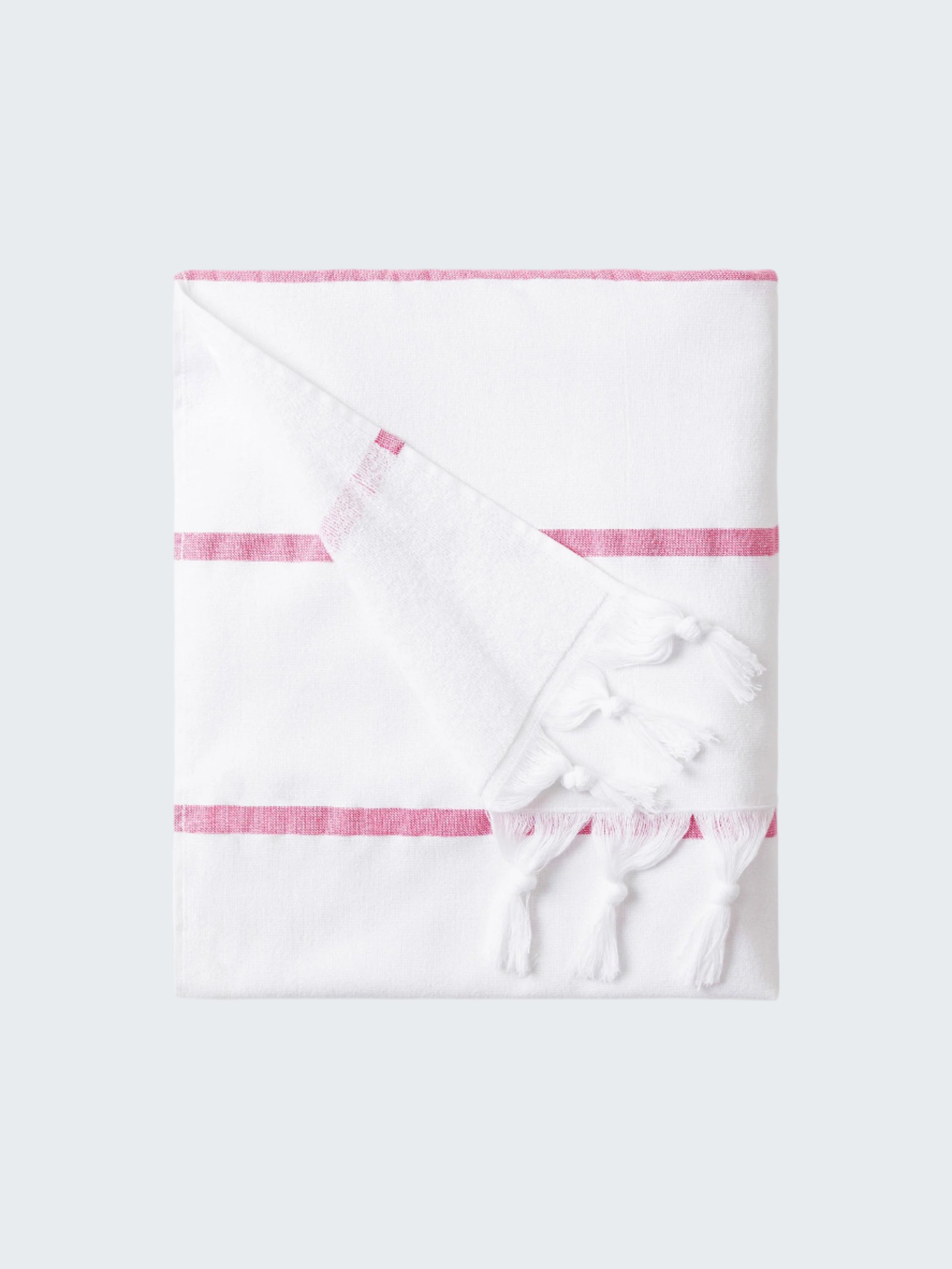 White towel with pink stripes on a white background
