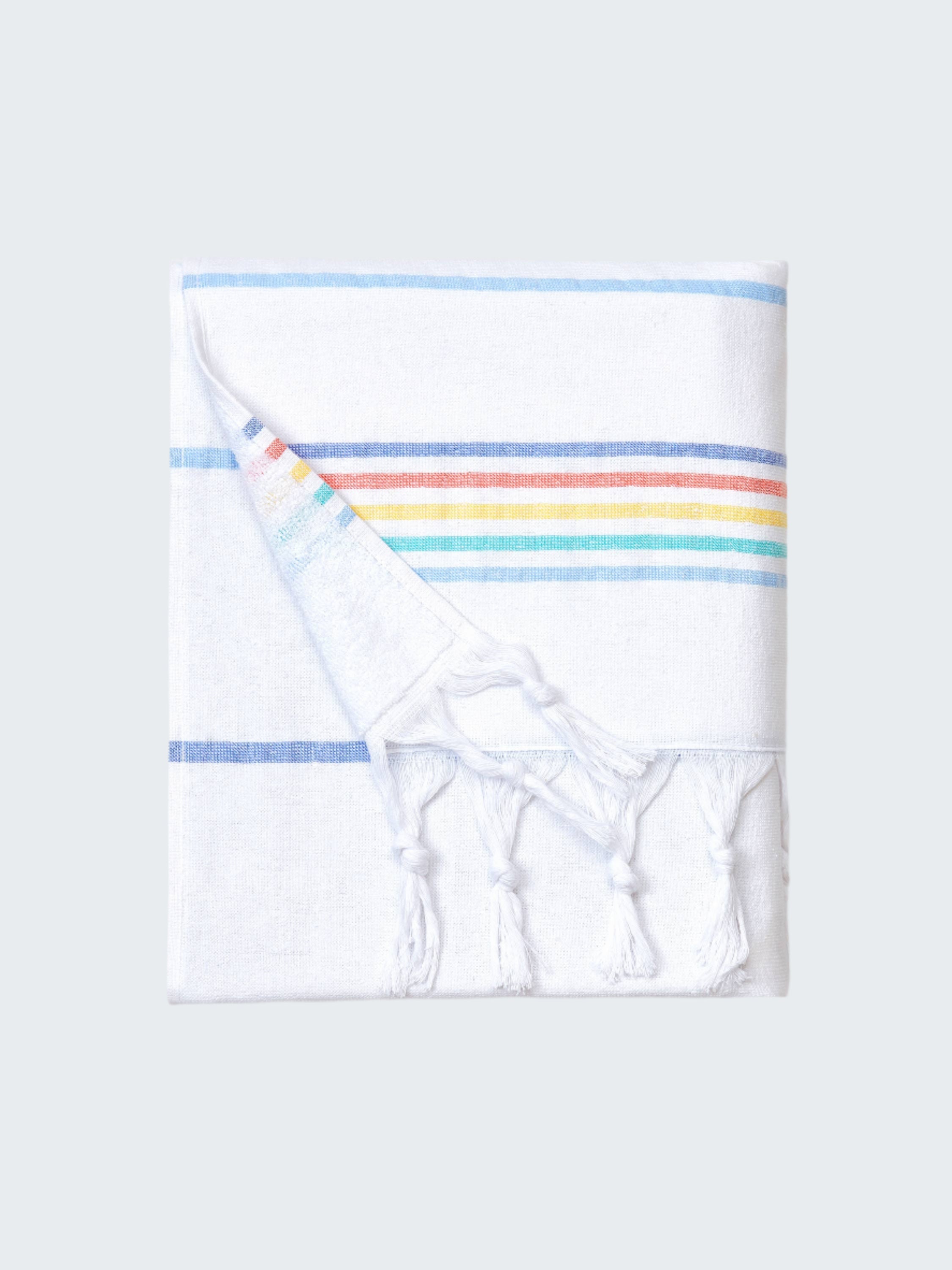 Folded towel with rainbow stripes on a white background