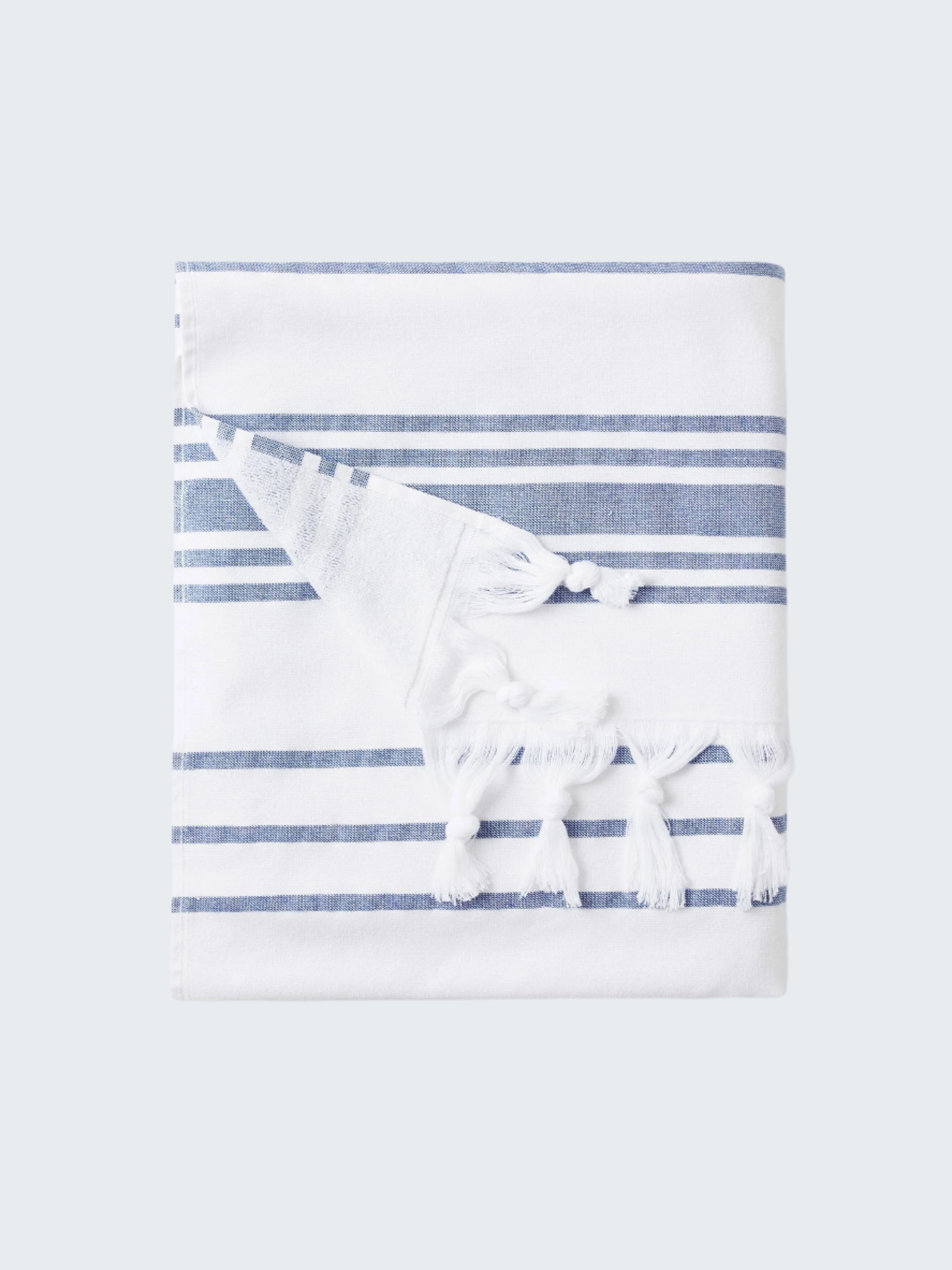 Striped towel with a bow on a white background