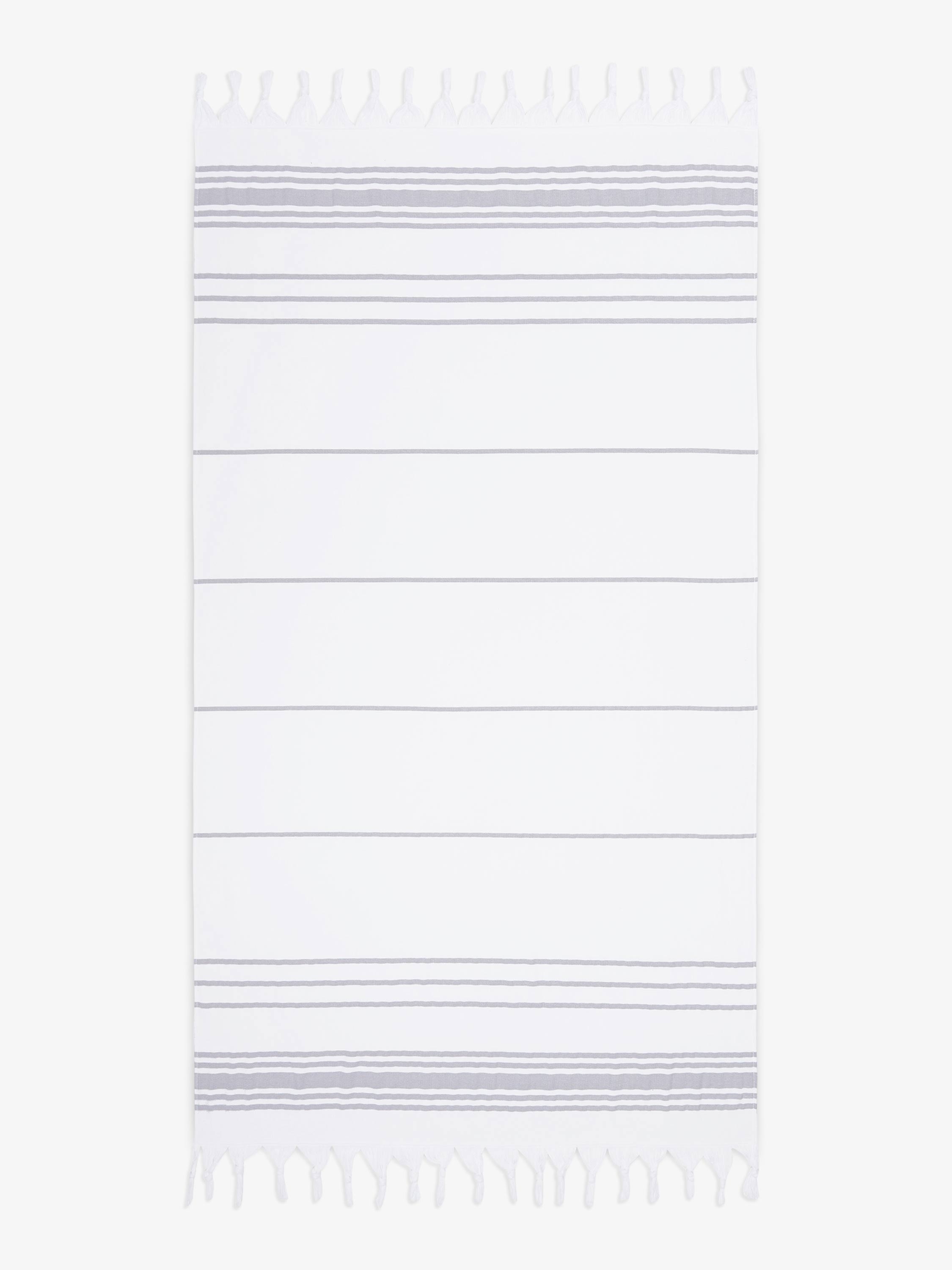 White towel with thin purple stripes on a white background