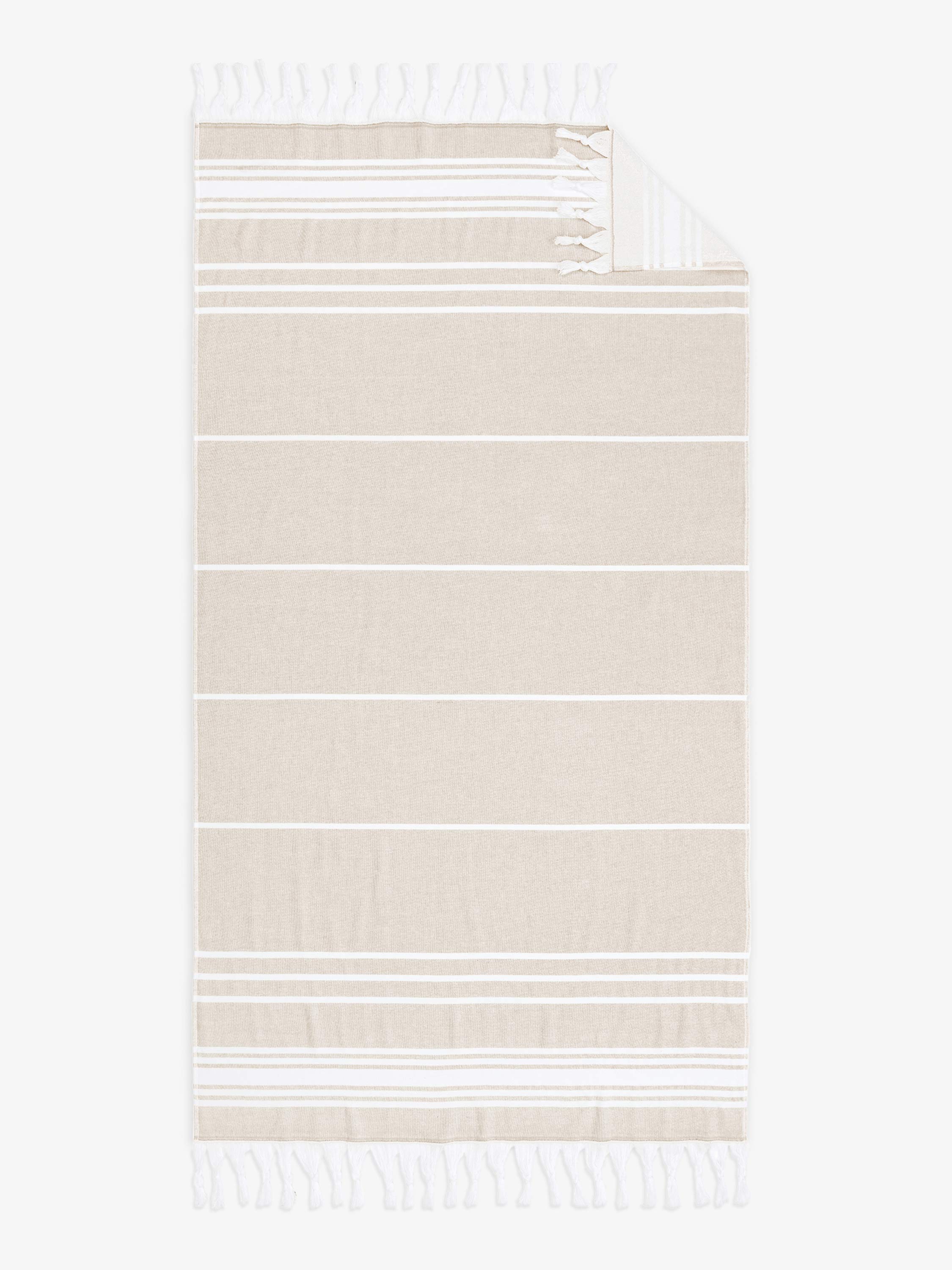 Beige and white striped towel with tassels on a white background