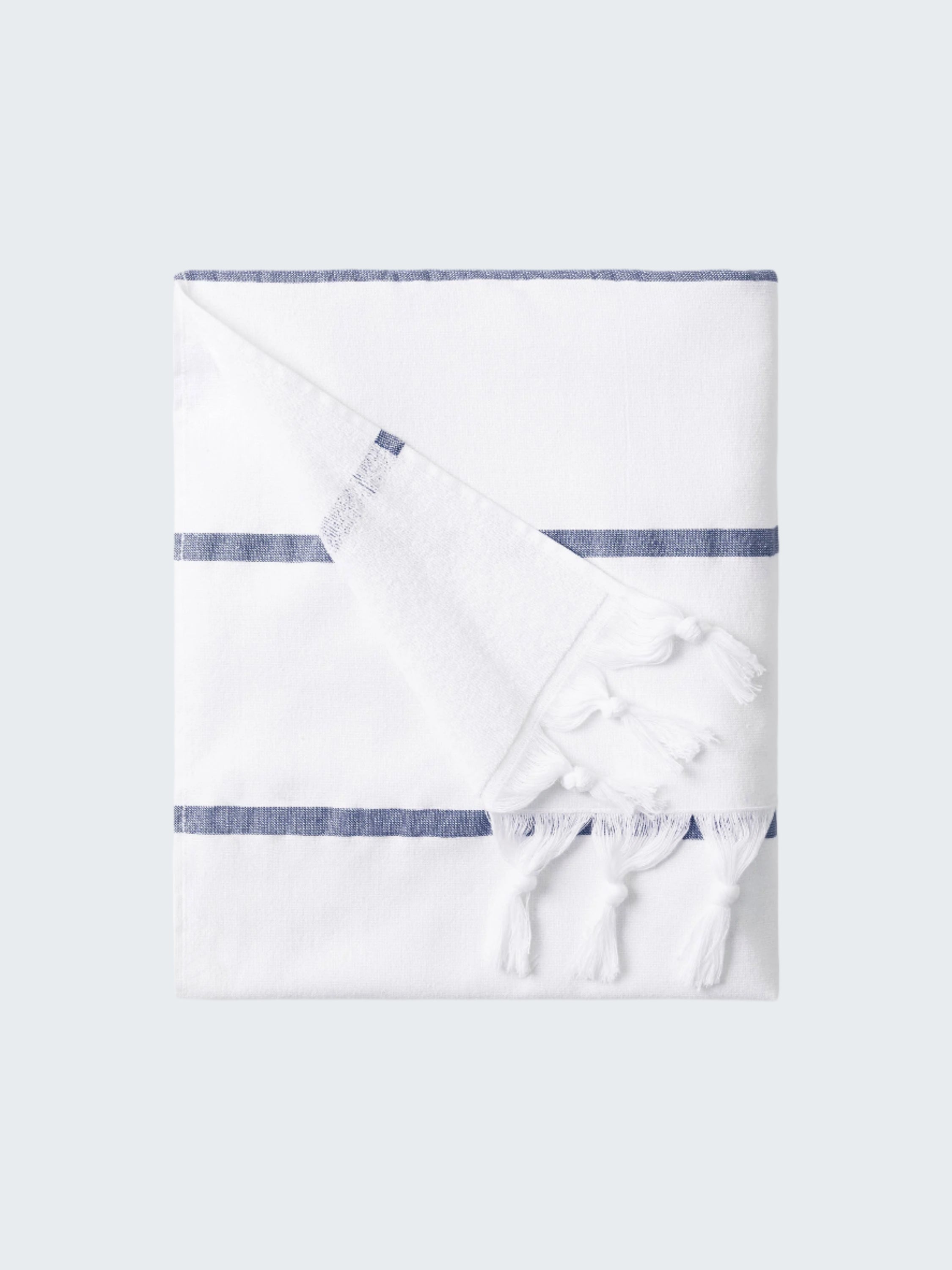 White towel with blue stripes on a white background