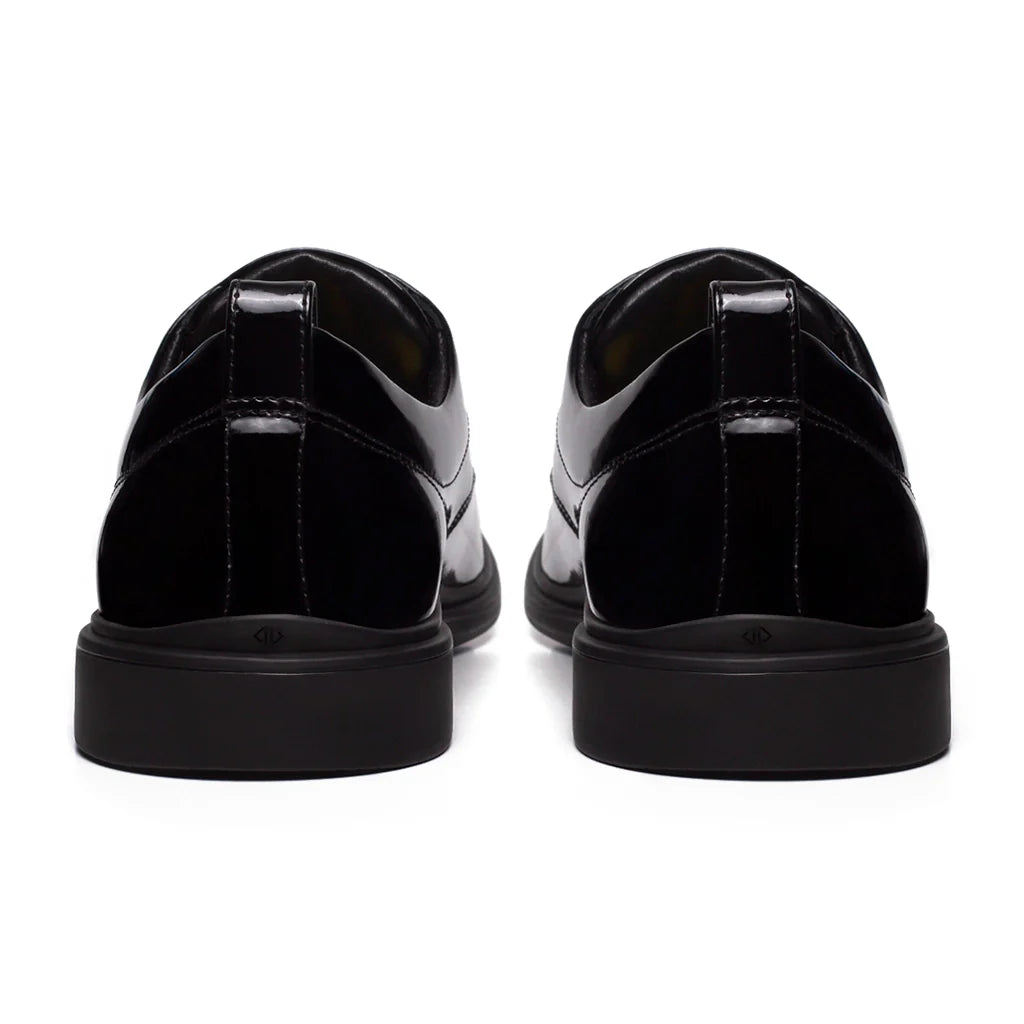 Black shoes with a glossy finish on a white background