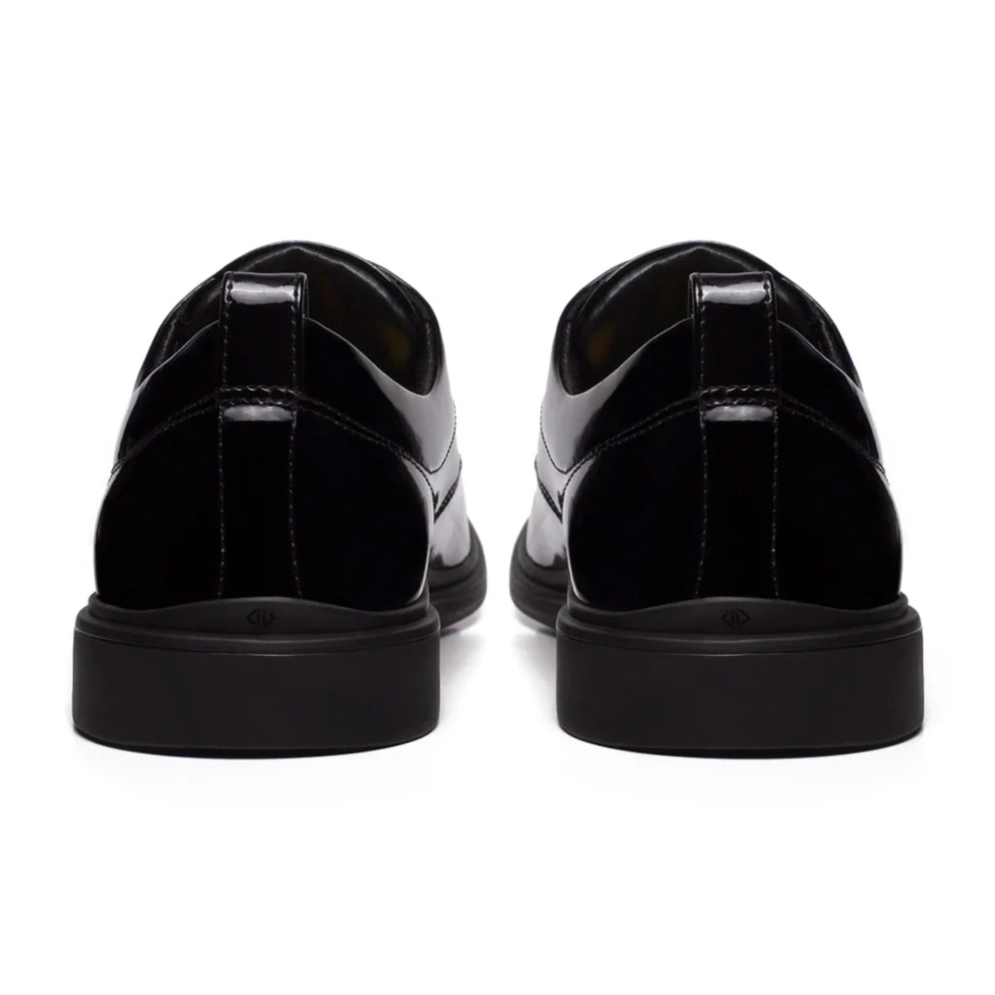 Black shoes with a glossy finish on a white background