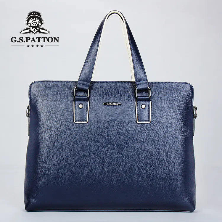 Blue leather briefcase with G.S. Patton logo on a light gray background