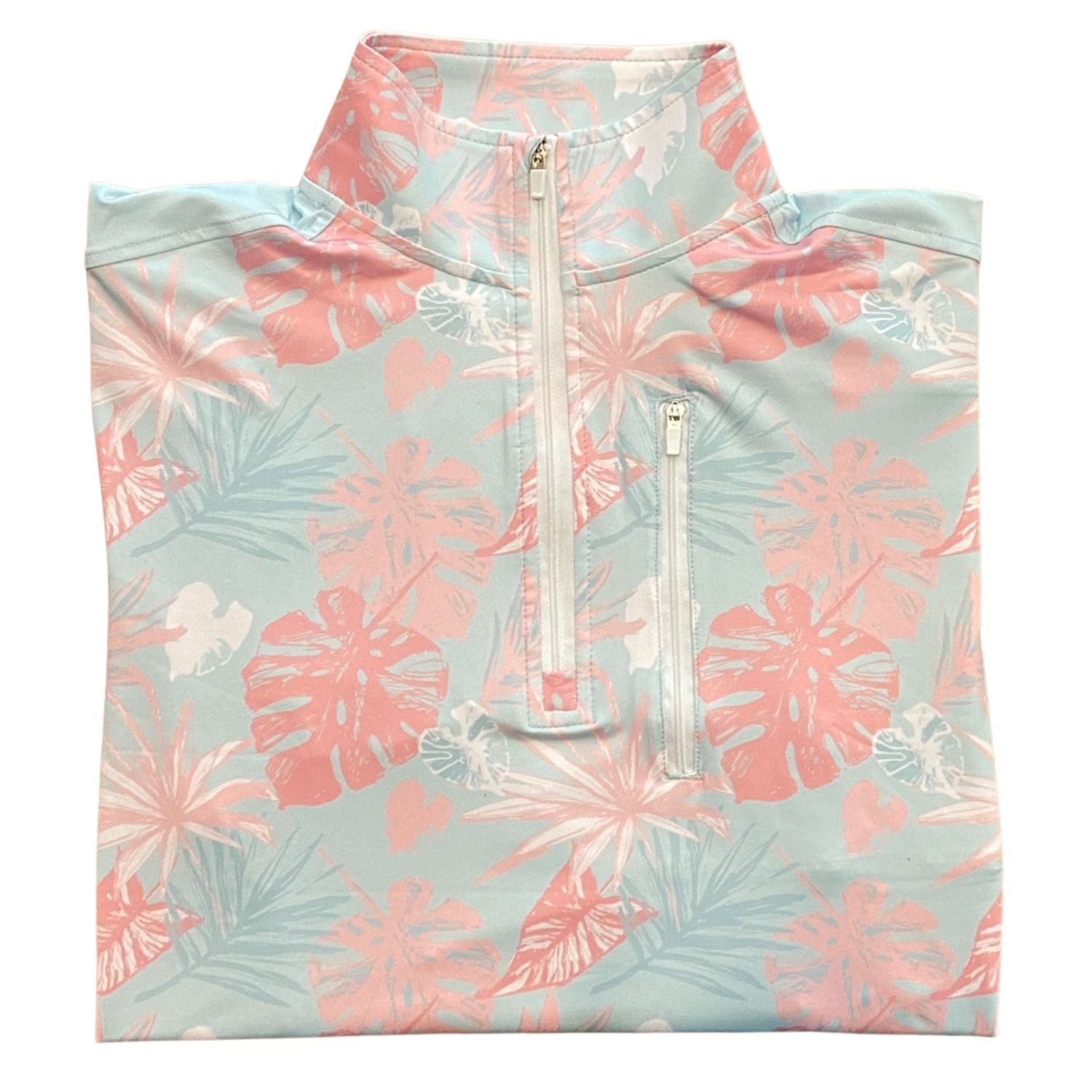 Tropical patterned shirt with a quarter zip on a light blue background