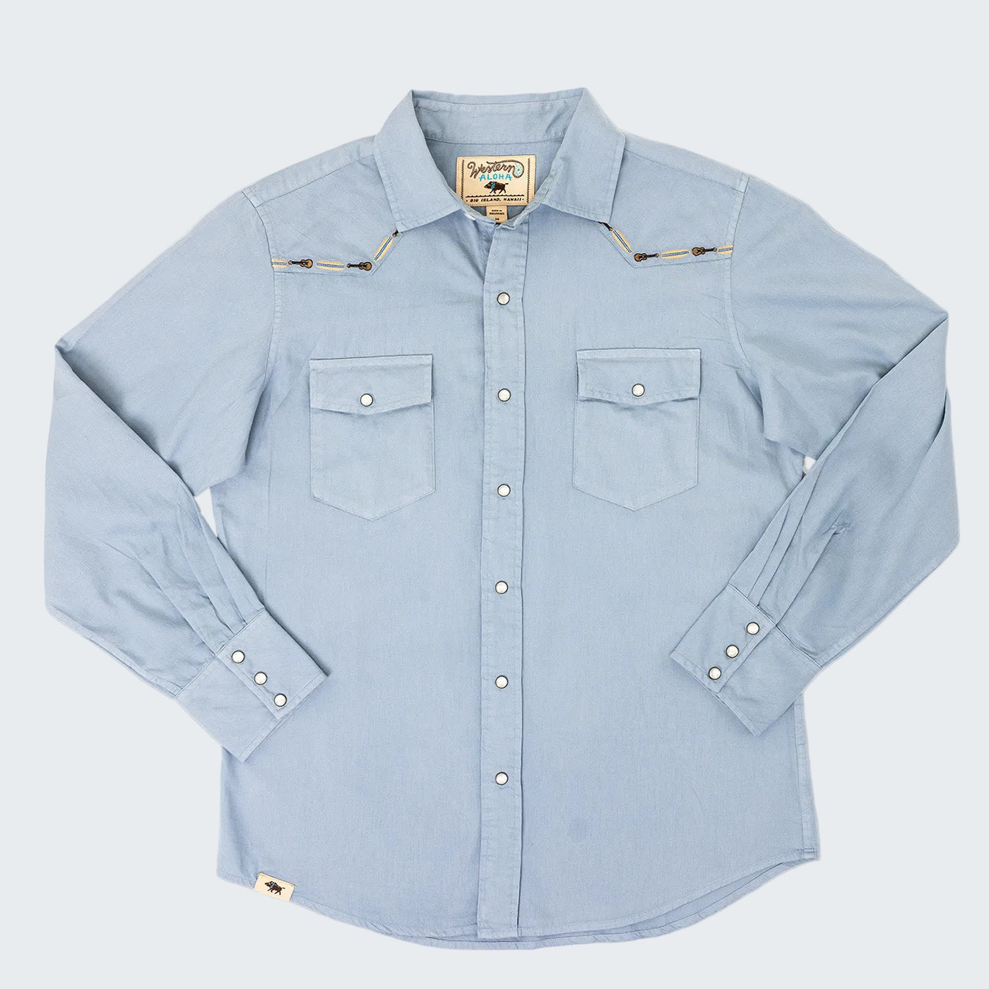 Light blue denim shirt with button details on a white background
