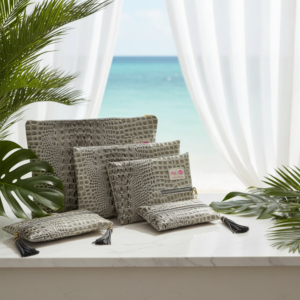 Three patterned bags with tassels on a white background