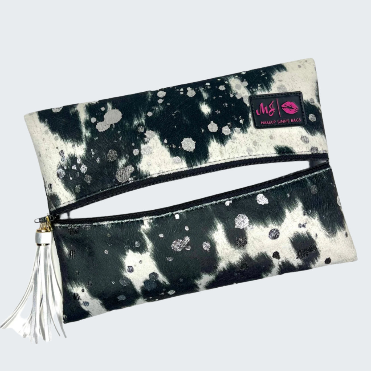 Black and white tie-dye clutch bag with a visible brand logo on a white background