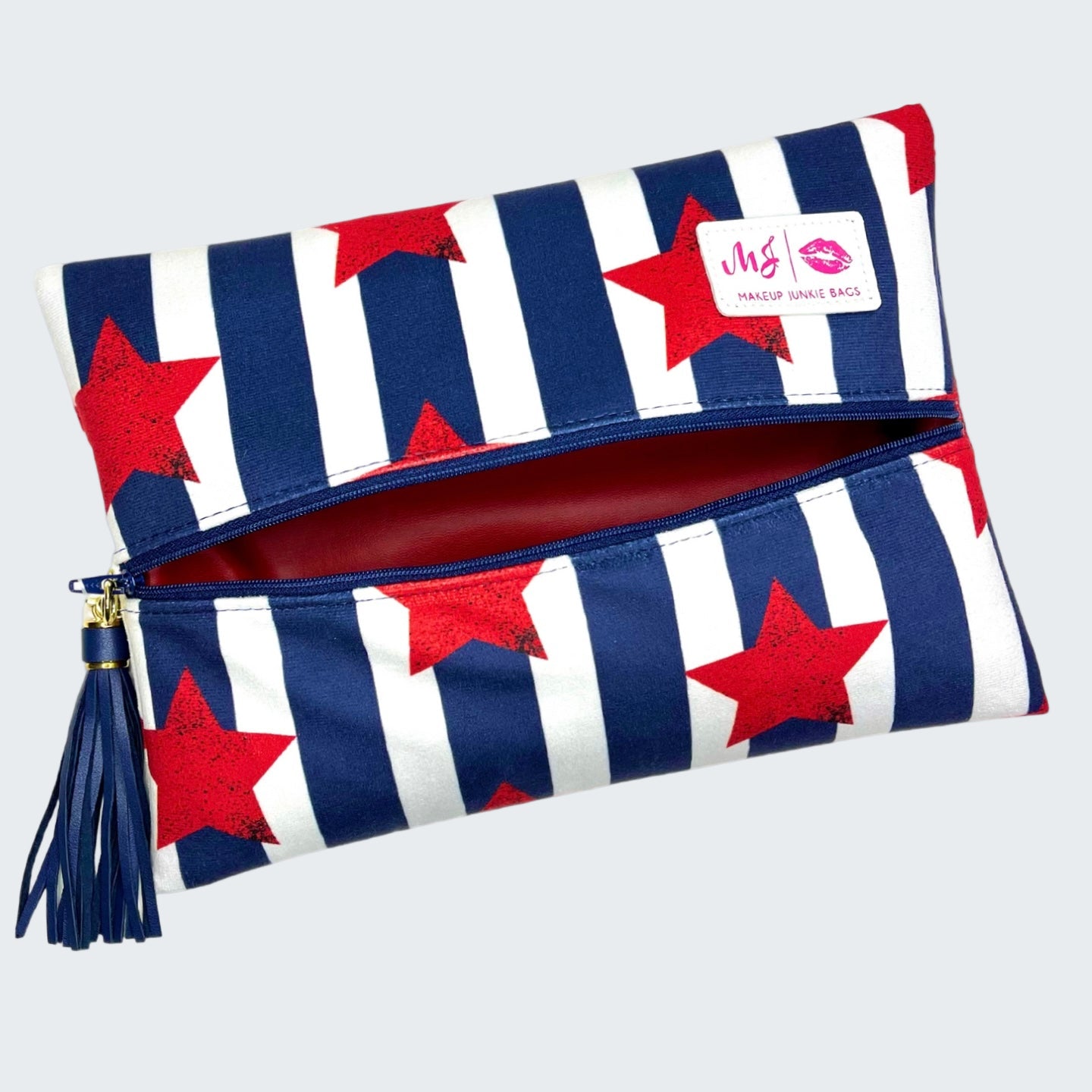 Makeup pouch with red stars and blue stripes on a white background