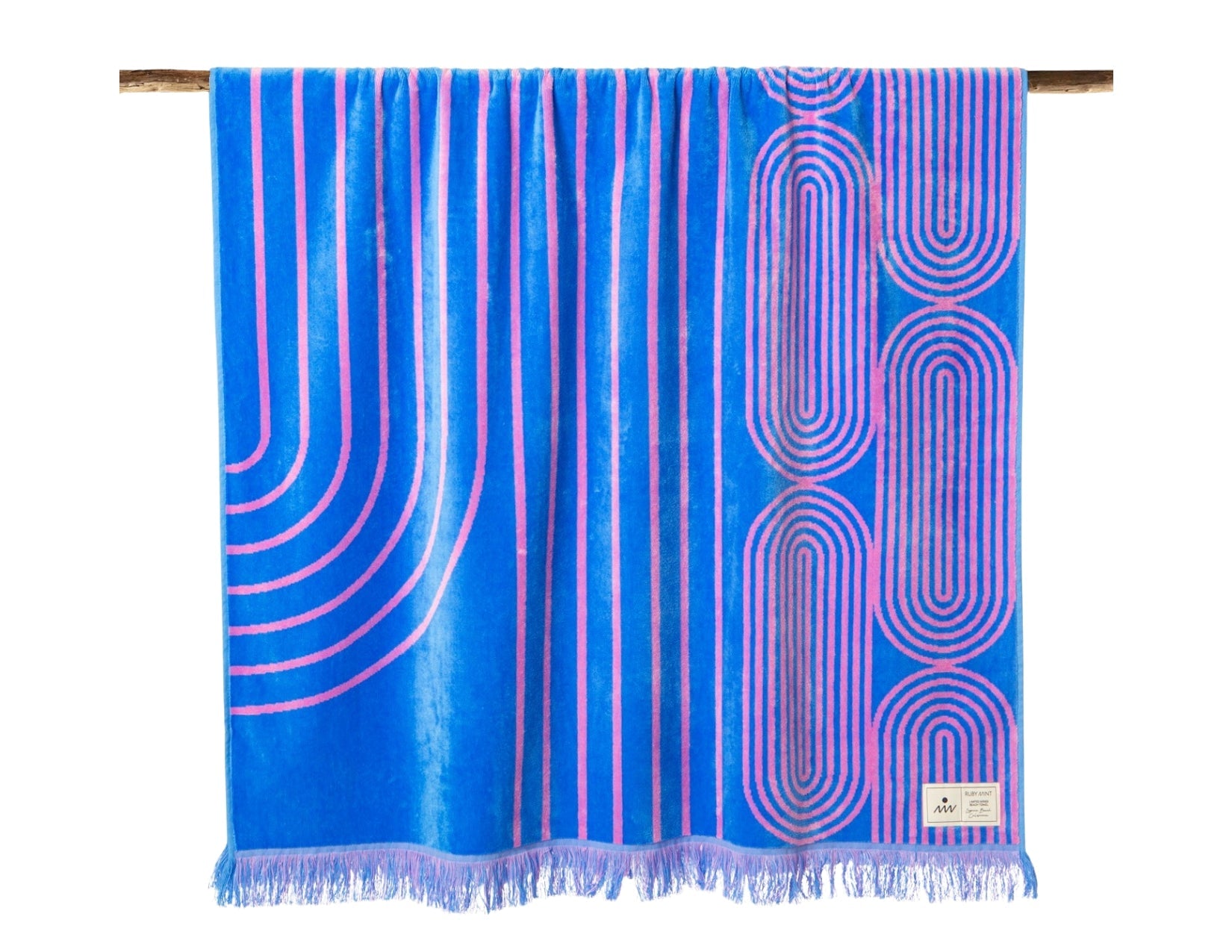 Blue towel with pink geometric patterns on a white background
