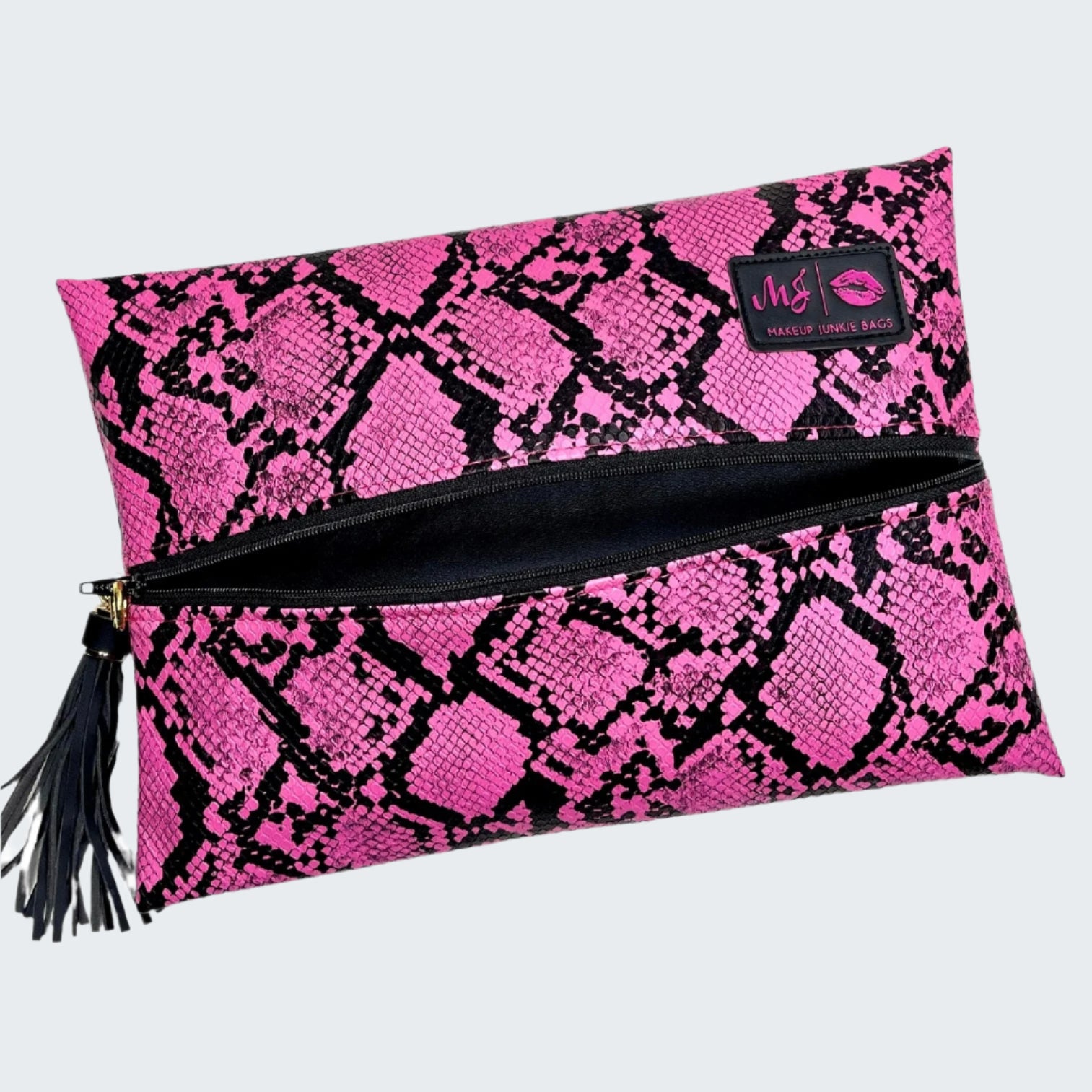 Pink and black snake print clutch bag with a visible brand logo on a white background