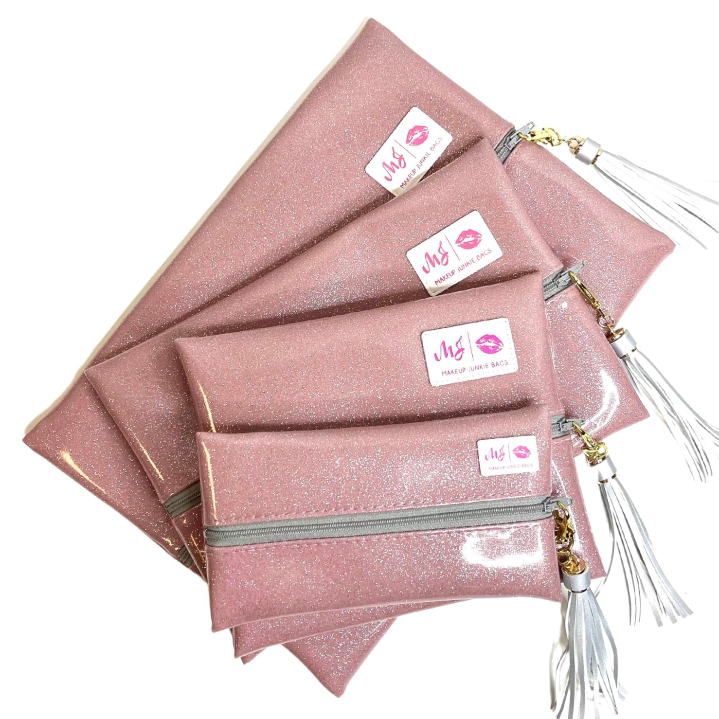 Set of pink glittery makeup bags with visible brand labels on a white background