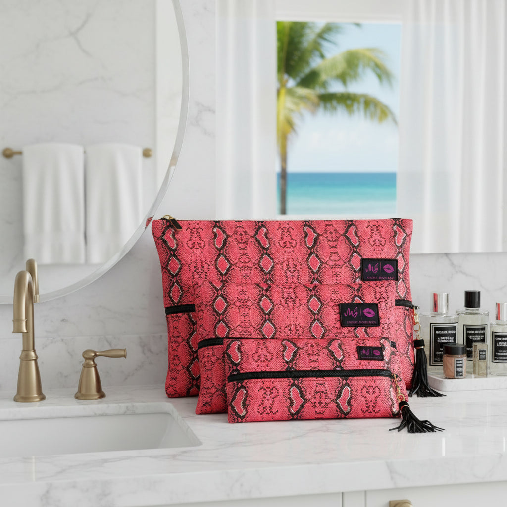 Red patterned clutch bag with black tassels and visible brand label on a white background