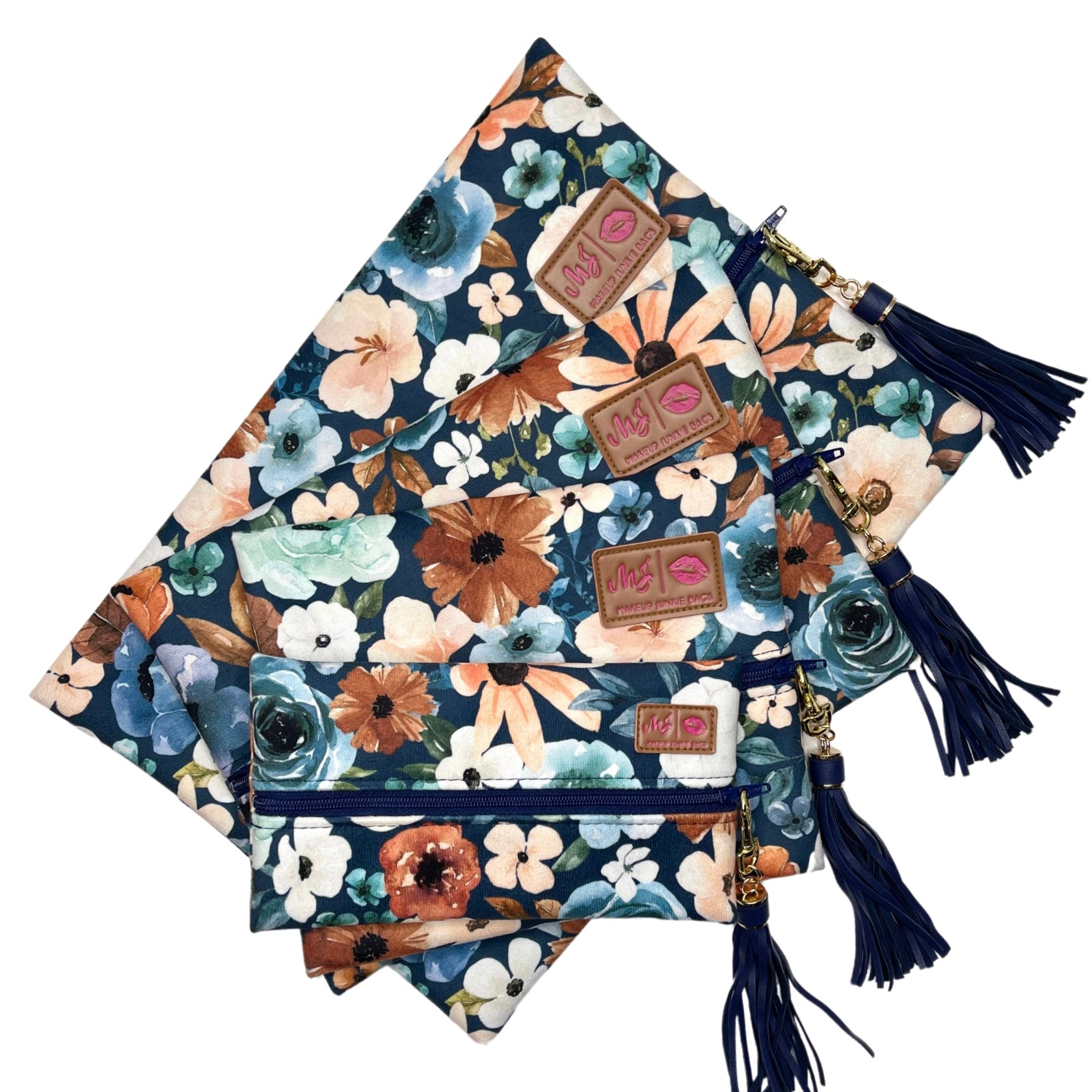 Floral-patterned pouches with tassels on a white background