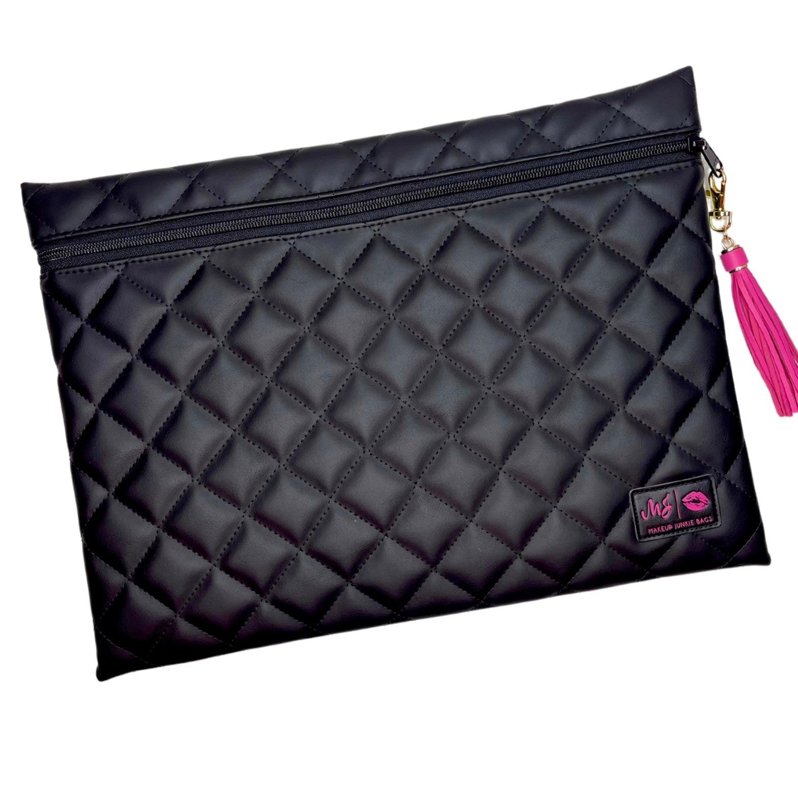 Black quilted clutch bag with a pink tassel on a white background