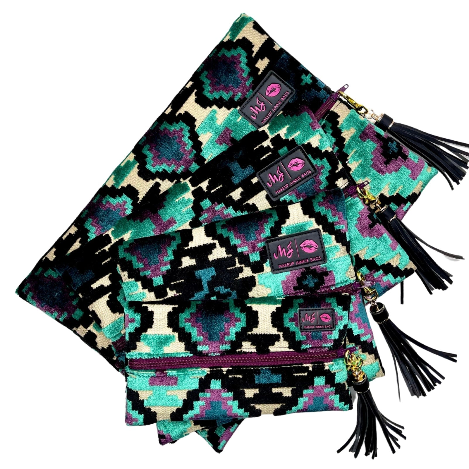Stack of patterned pouches with tassels on a white background