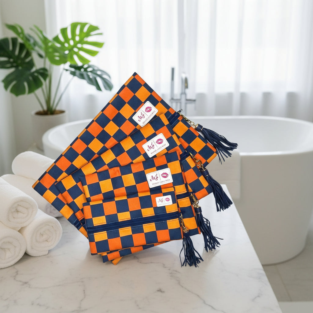 Set of orange and blue checkered bags with tassels on a white background