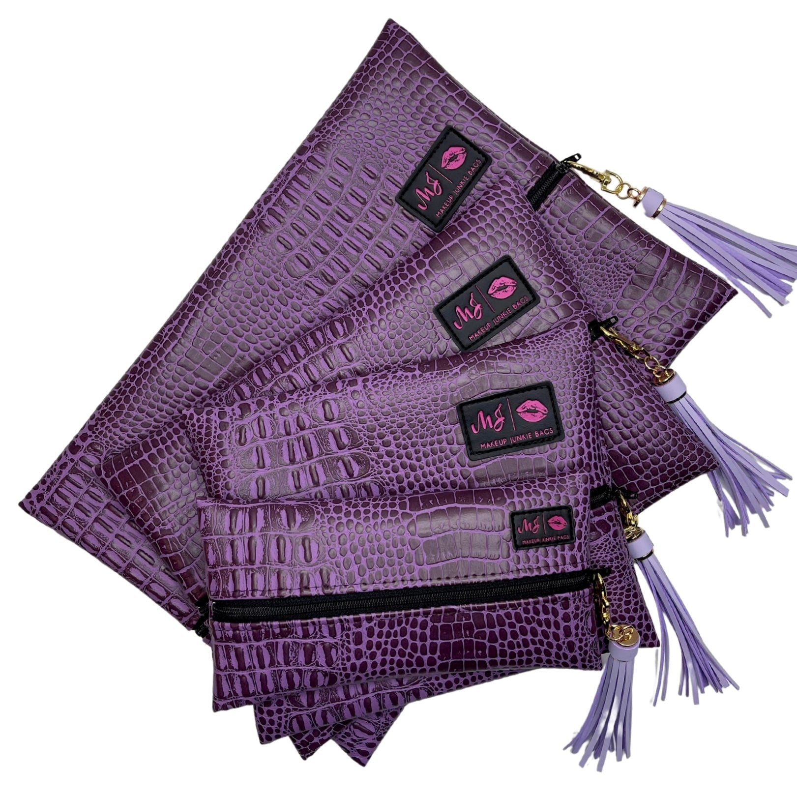 Purple textured pouches with tassels and visible brand logo on a white background